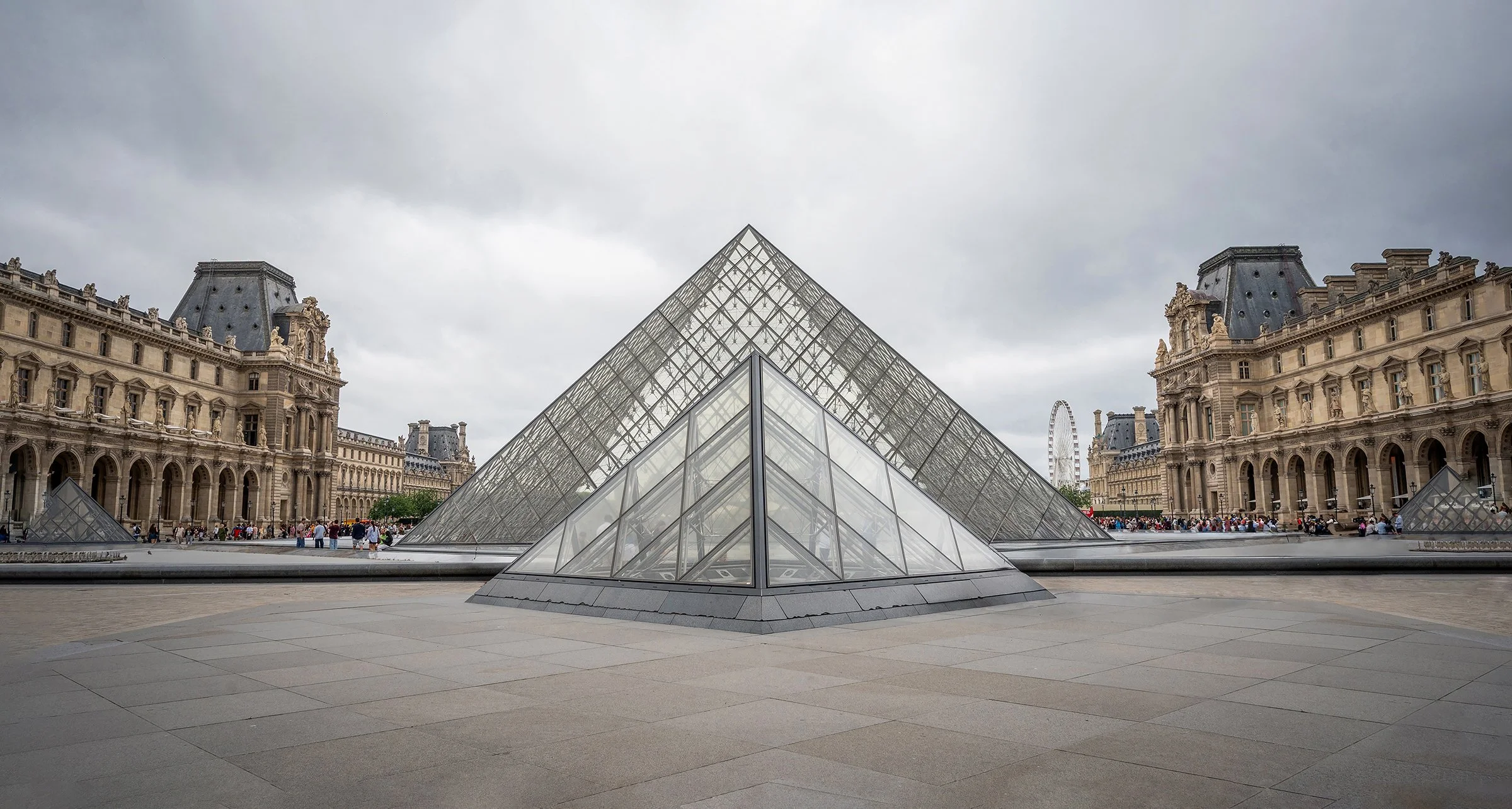 Visiting the Louvre has been a lifelong dream — and finally seeing it in person was nothing short of magical! While the masterpiece art works inside are world-renowned, the building itself is just as breathtaking. On this particular day, a soft overc