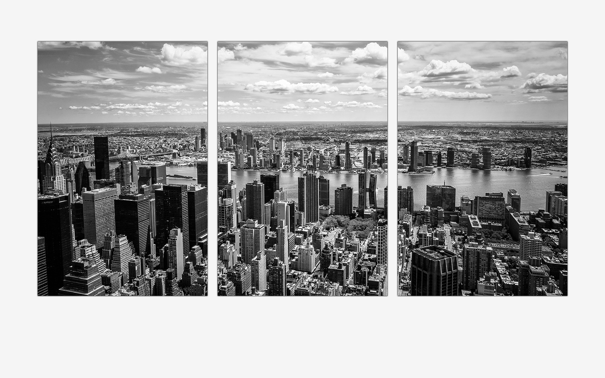 Capture the magic of New York City with this stunning black and white view from the iconic Empire State Building. There's a timeless quality to black and white photography that brings out the soul of the city — the towering skyline, the endless energ