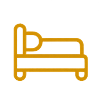 A yellow wooden park bench with a yellow cushion, set against a green background.
