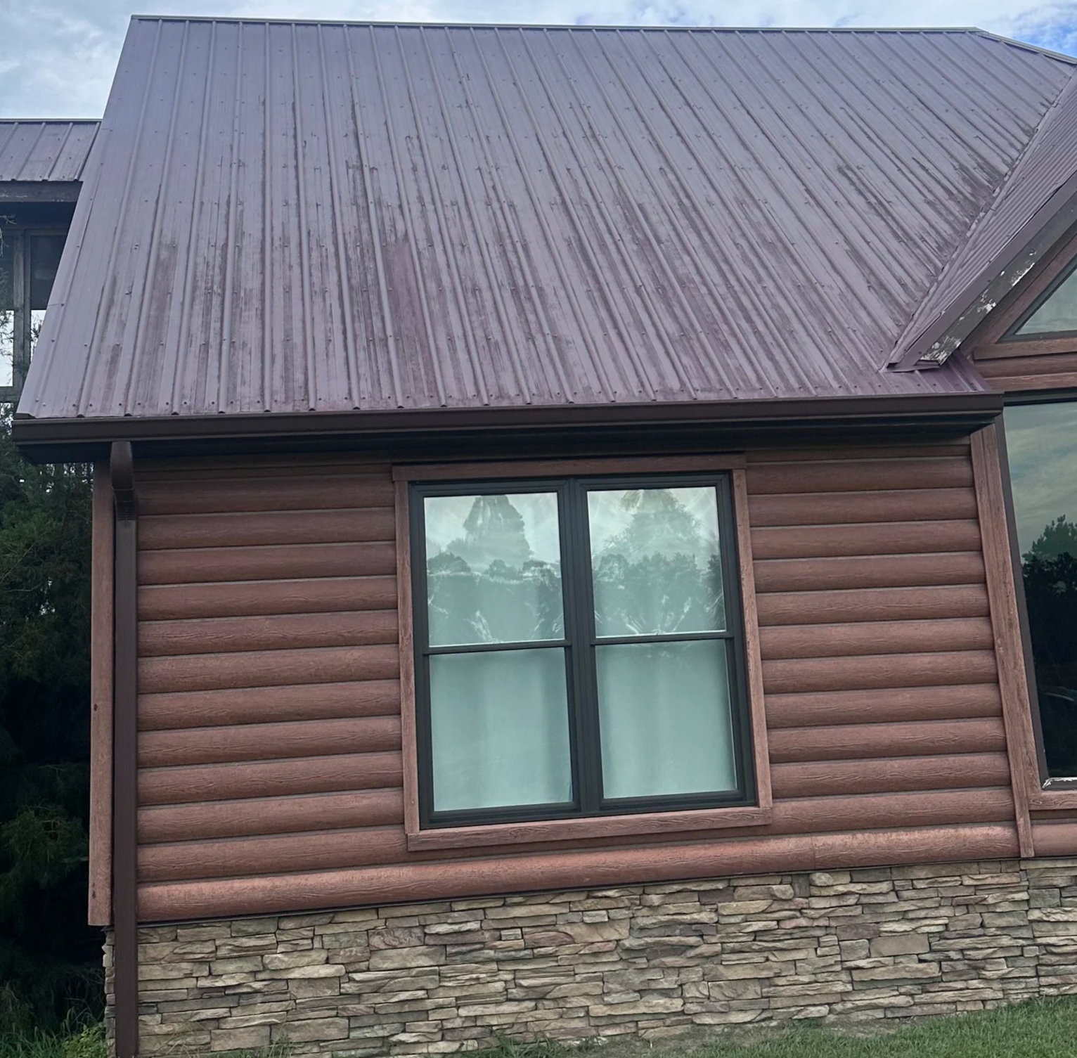 Before and after roof washing in Statesboro GA by Stephens Exteriors