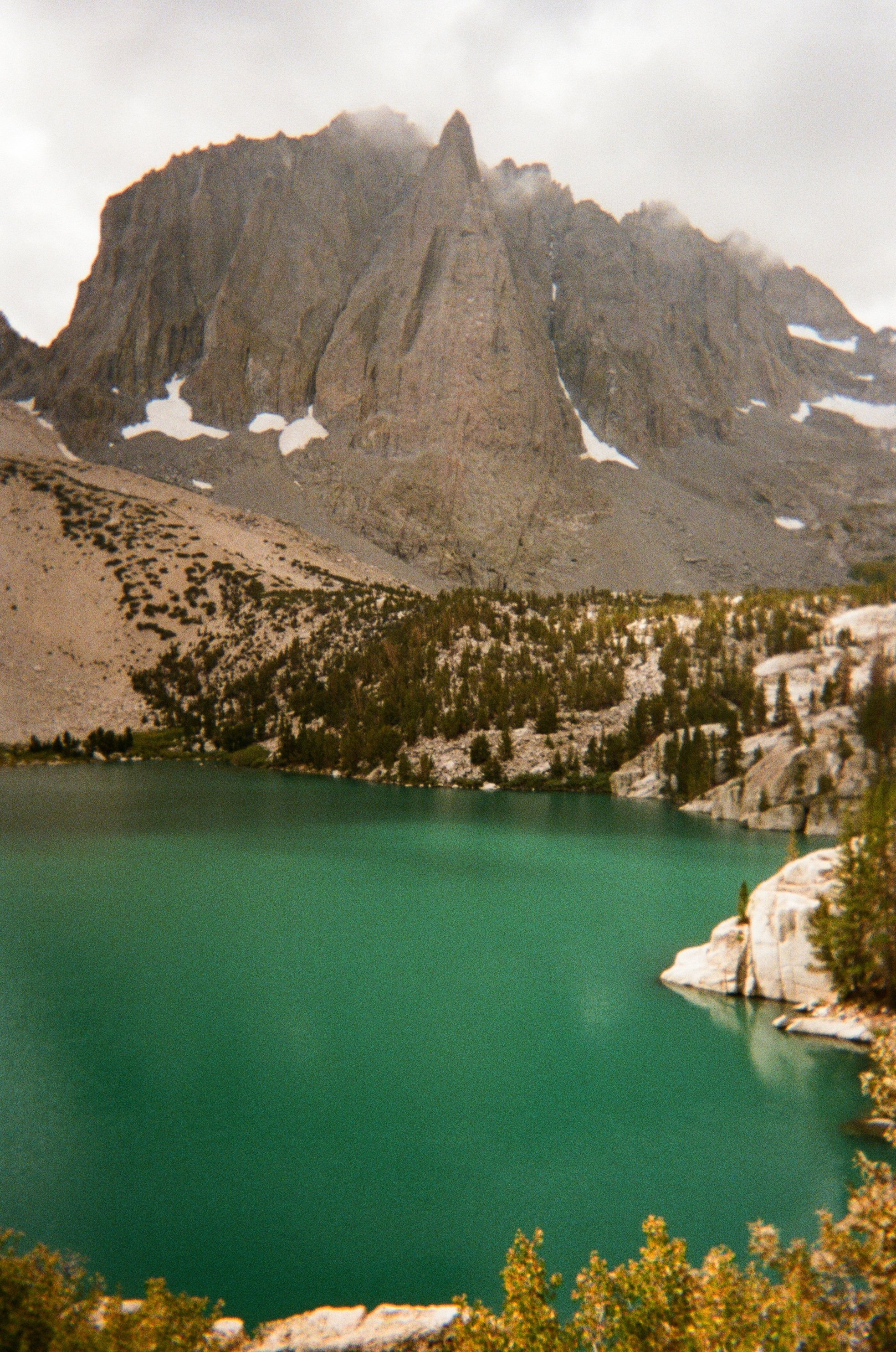 Big pine lake loop featuring big pine lake, the first of the lakes on the loop with a mountain in the background. It started snowing after this photo was taken. 