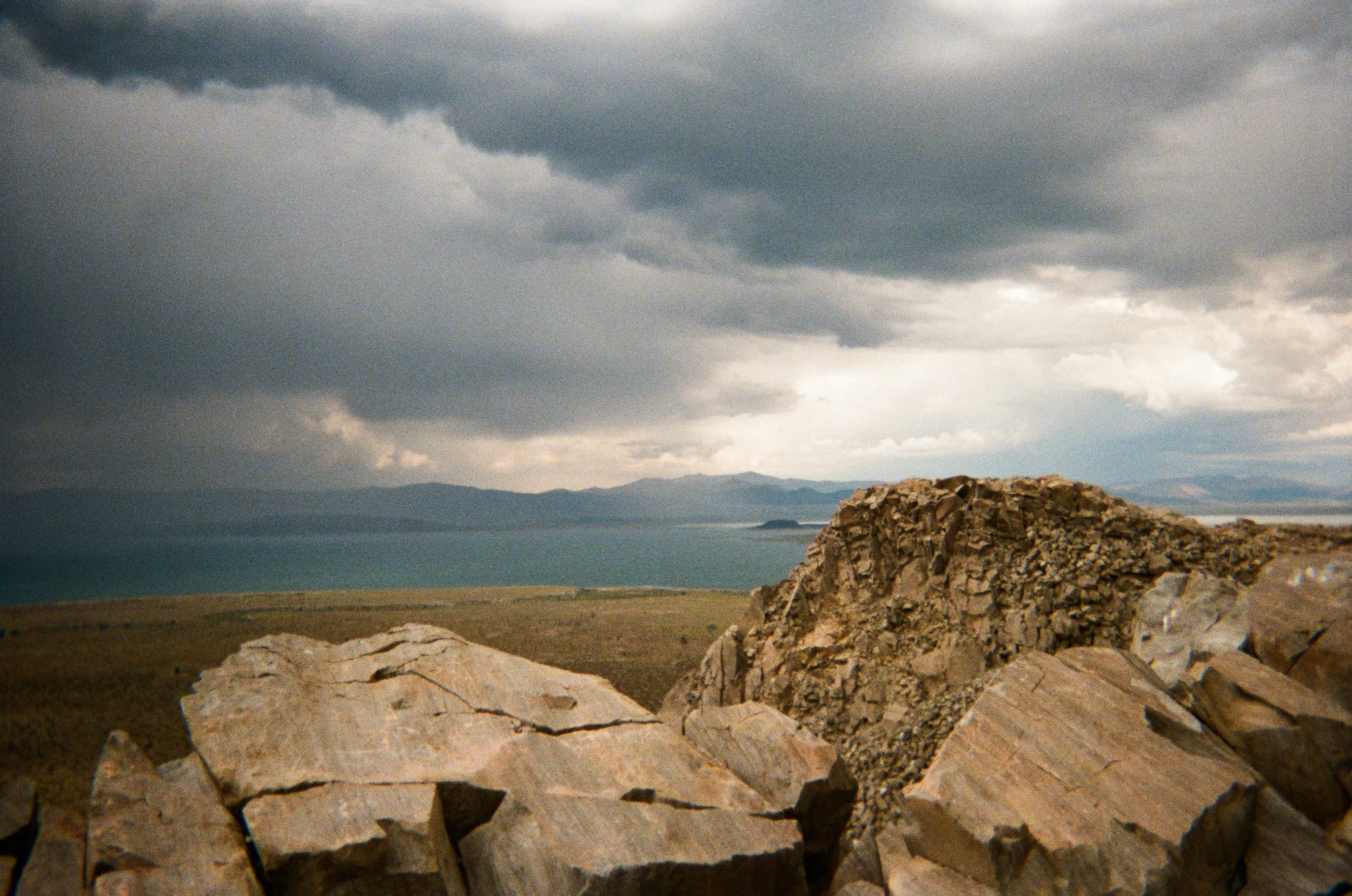Photo of Mono Lake during a rainstorm at the top of a mountain. Panum Crater 