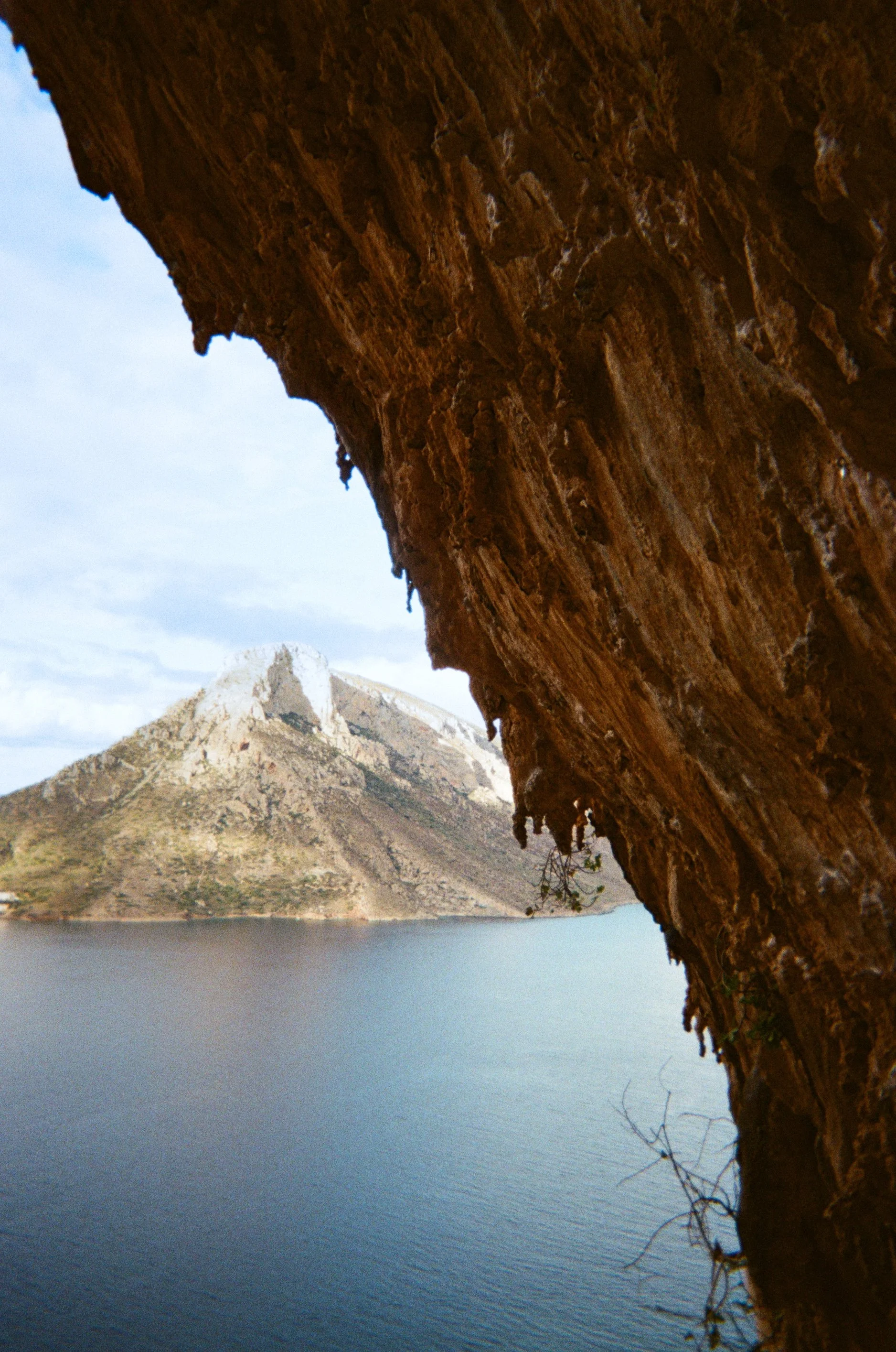 Photo of Talendos Island in Greece taken from the Grande Grotta. Tufas appear in the image.