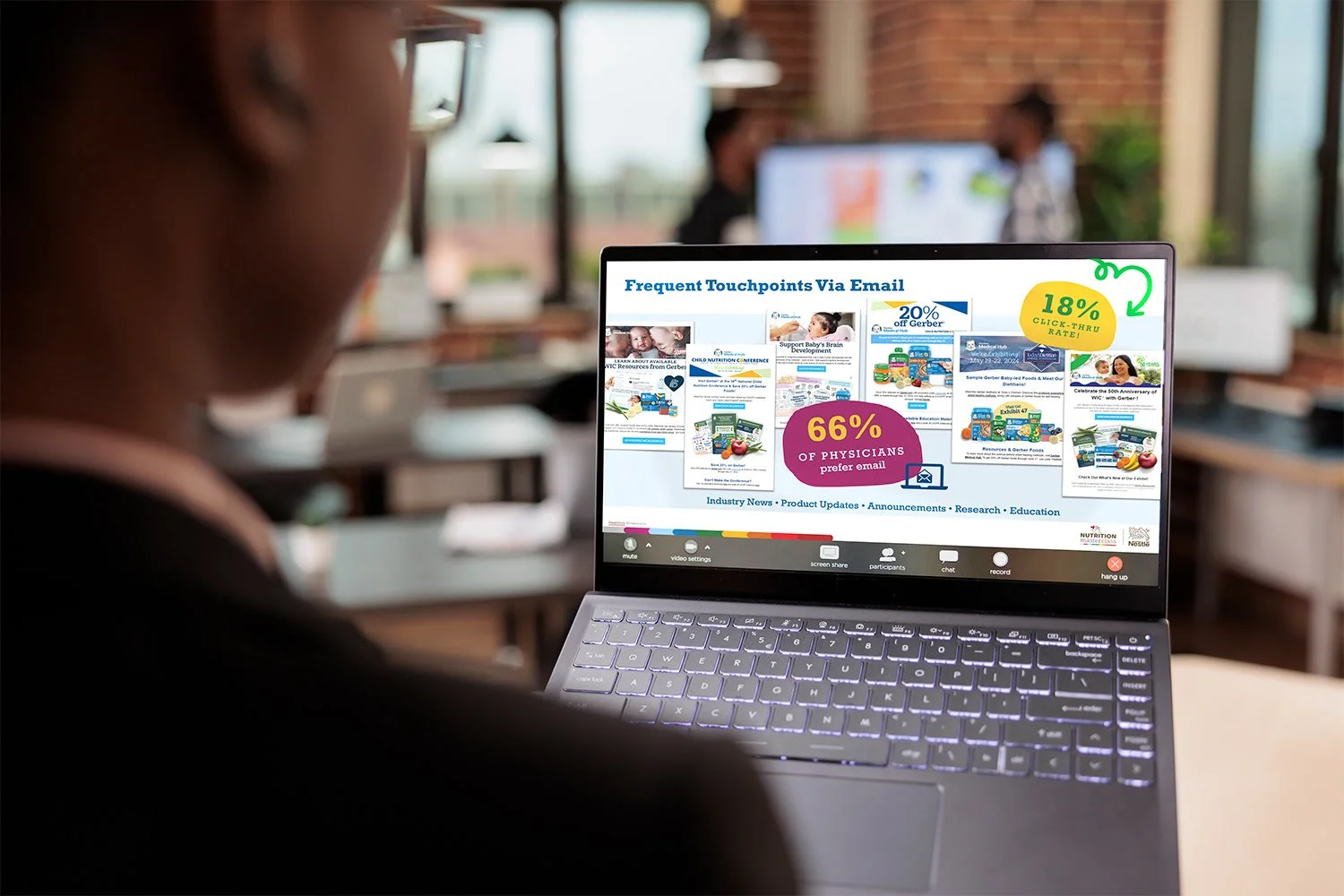 Person working on a laptop with a presentation slide called 'Frequent Touchpoints Via Email' displayed on the screen, showing statistics, images, and colorful elements.