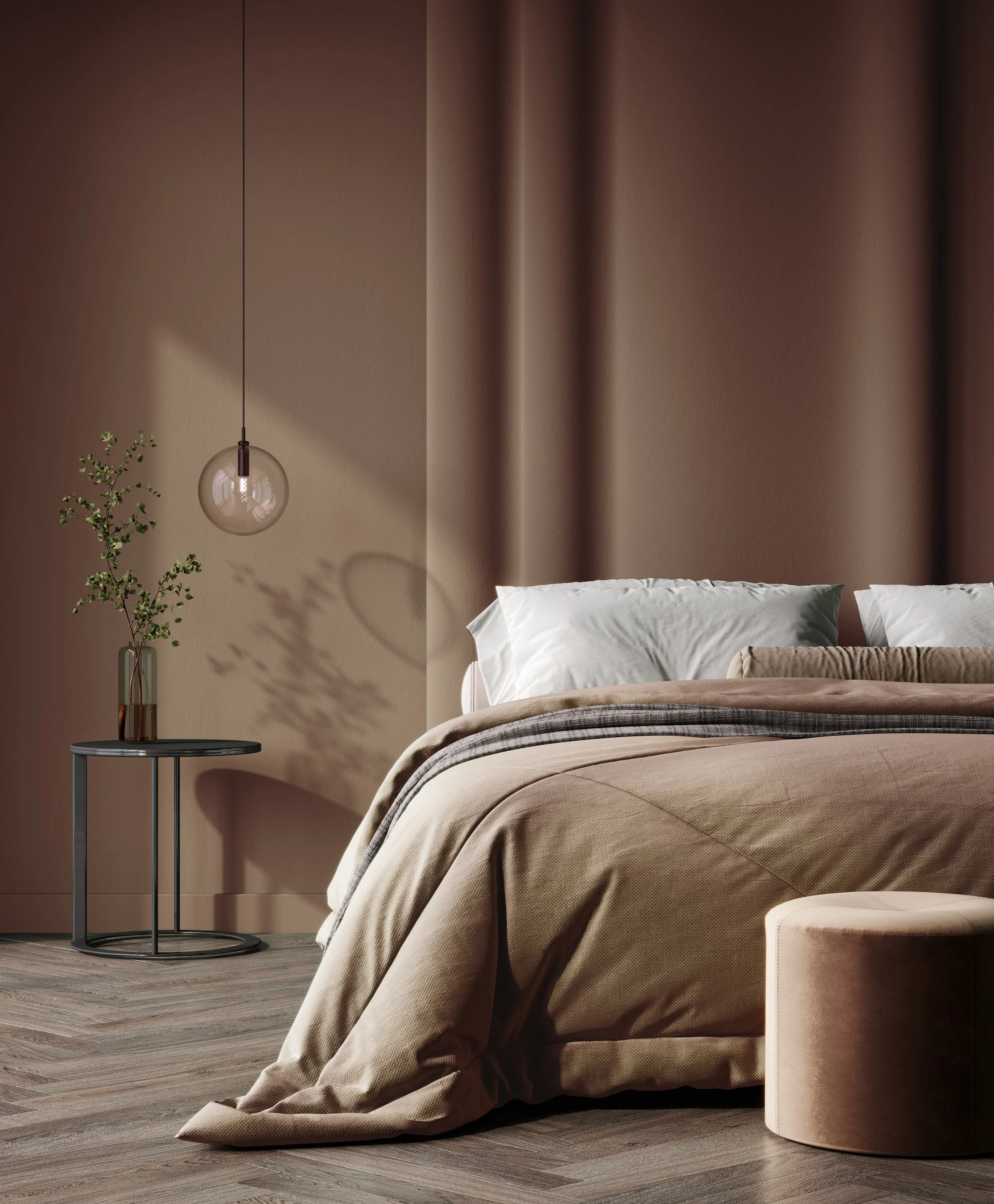 A bedroom scene featuring a bed with beige bedding and pillows, a small side table with a potted plant, a hanging pendant light, beige and brown curtains, and wood flooring.