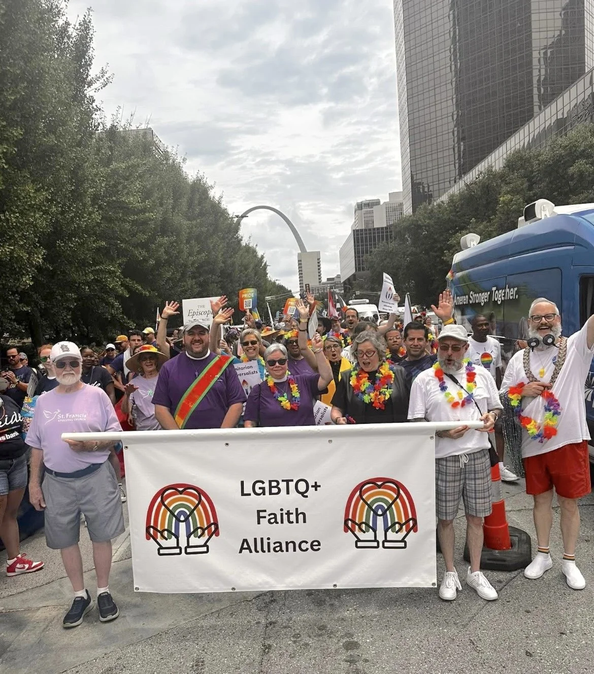 LGBTQ+ Alliance members holding a banner, participating in a parade.