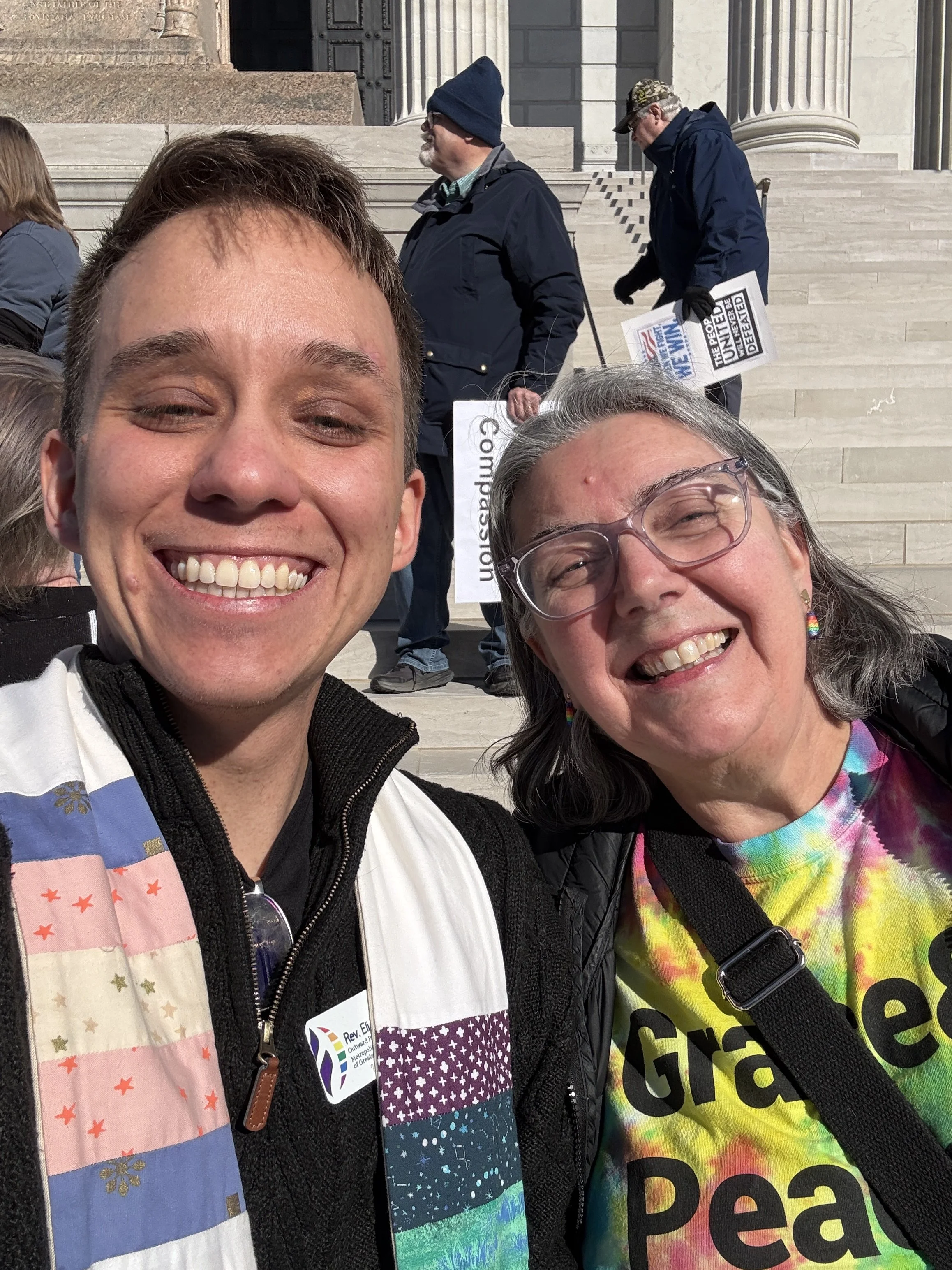 Two people, on the steps of Missouri's capitol, smiling.