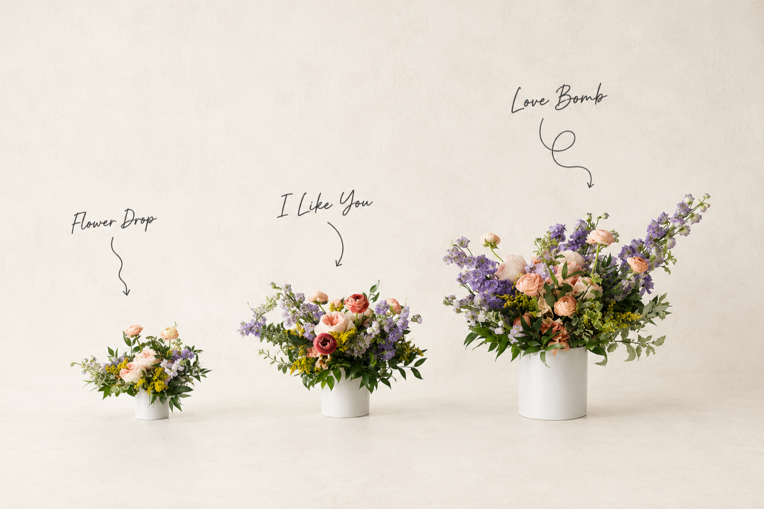 Three white vases with floral arrangements of pink, purple, and yellow flowers labeled from smallest to largest: Flower Drop, I Like You, Love Bomb.
