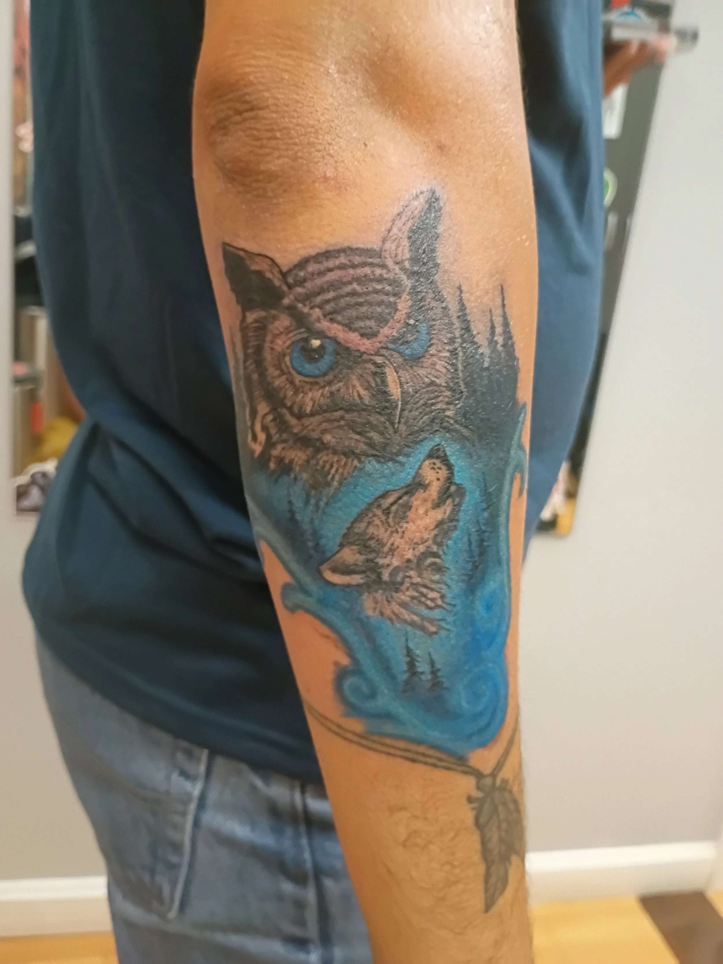 realistic owl and wolf tattoo