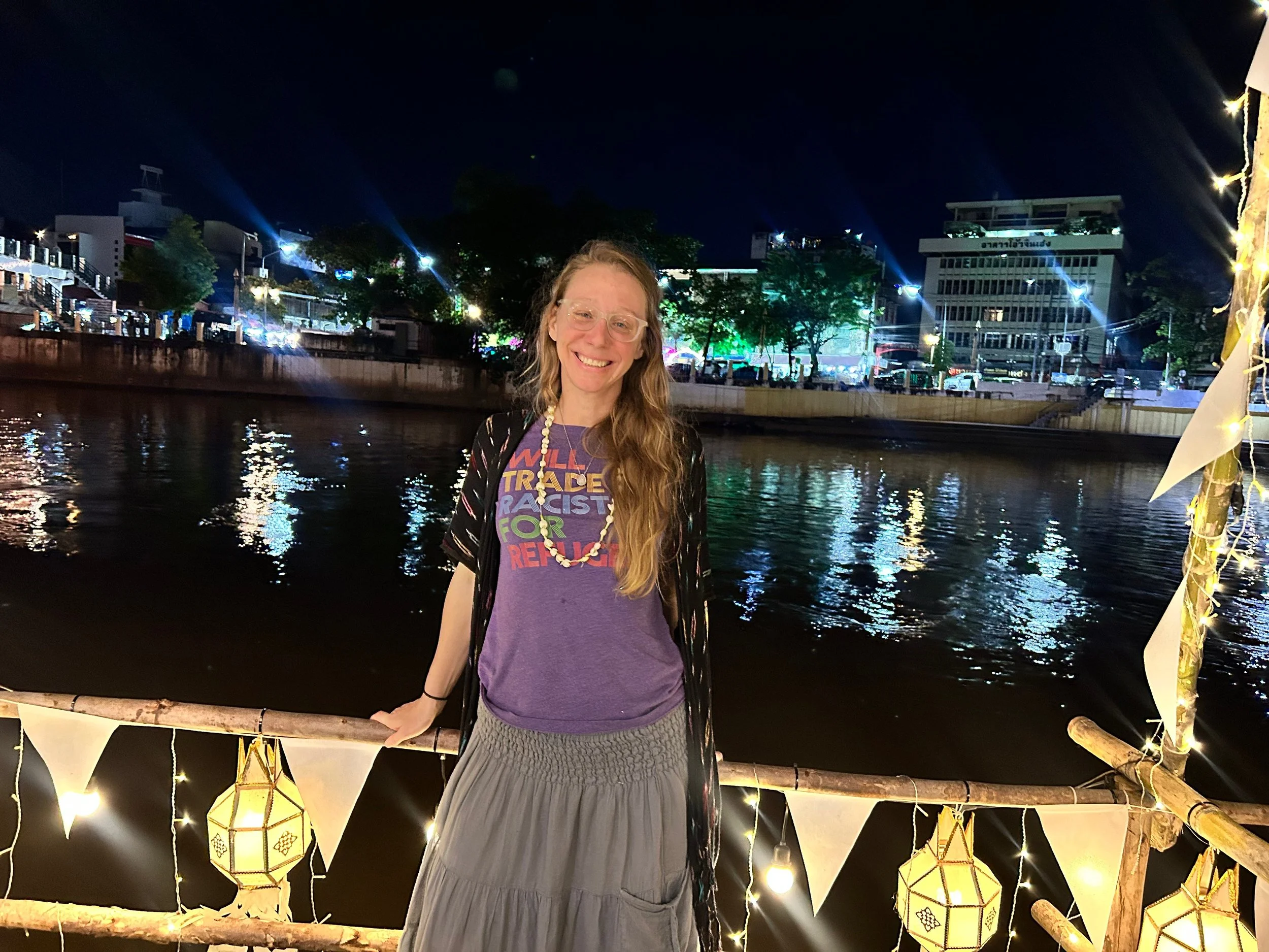 Posing on the Ping River in Chiang Mai after a street food tour and wearing my new favorite travel shirt