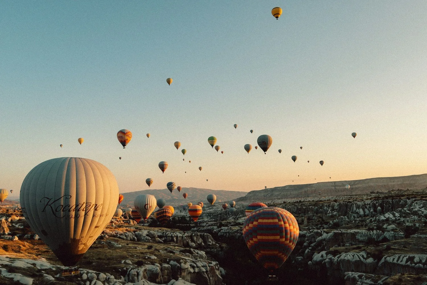 Hot air balloons over Cappadocia at sunrise