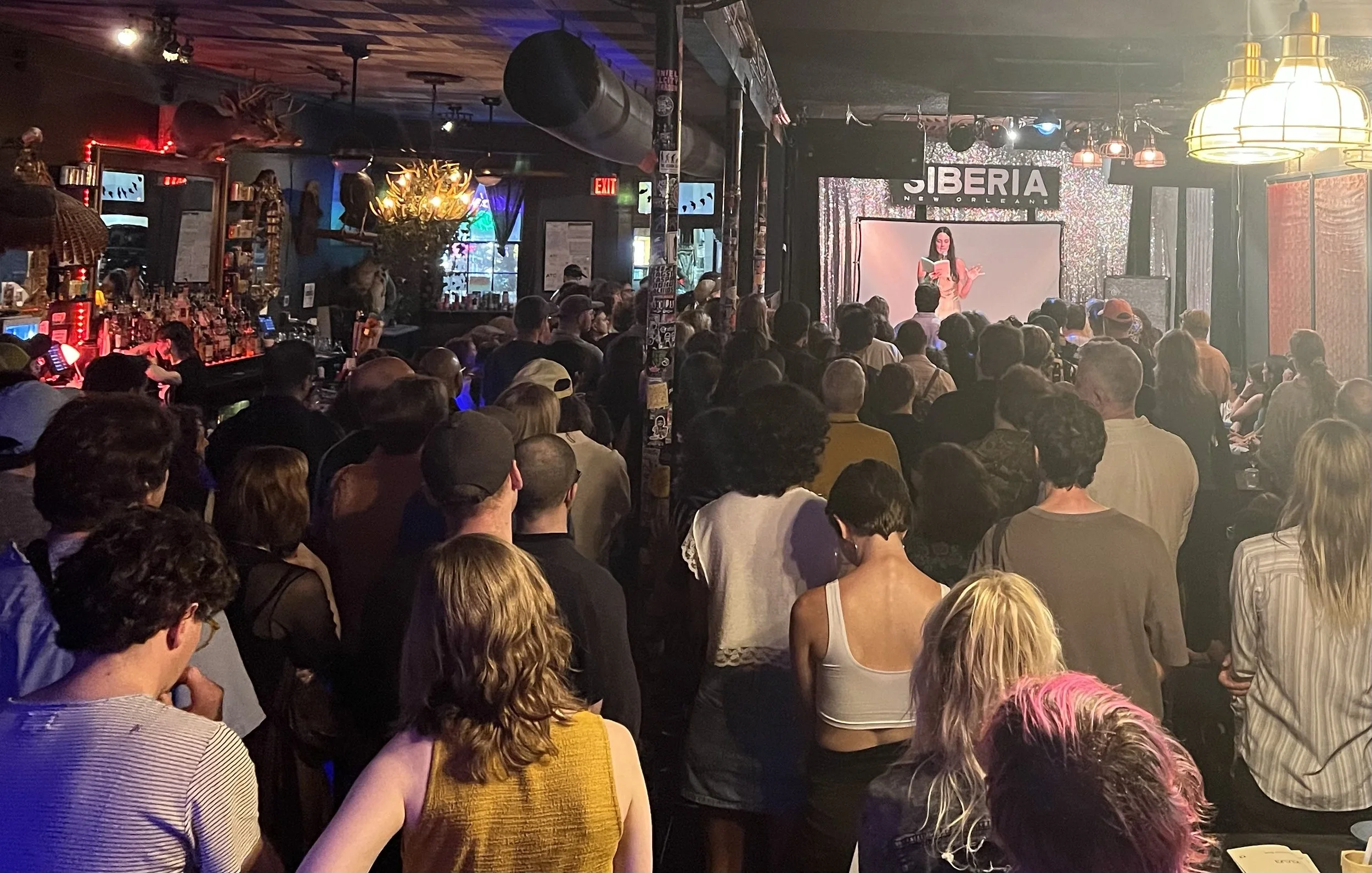 Poet Courtney Bush reads to a packed house at the New Olreans dive bar Siberia
