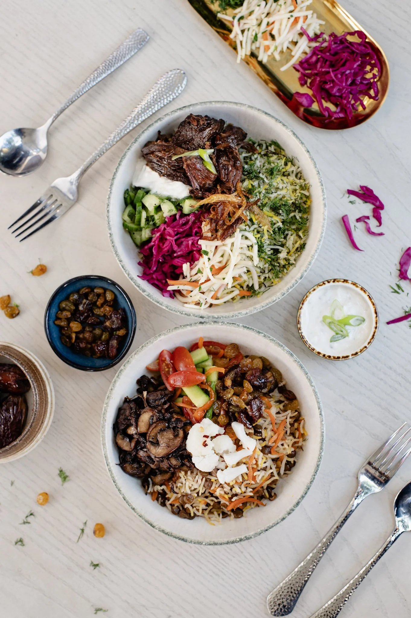 Baloot braised short rib and adas polo rice bowls with Persian pickles