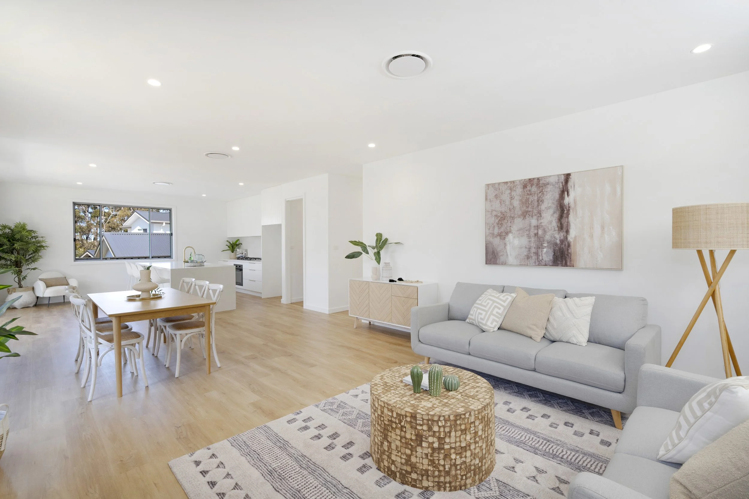 Bright and spacious living room and dining area with white walls in Newcastle custom built by SWW BUILDING GROUP