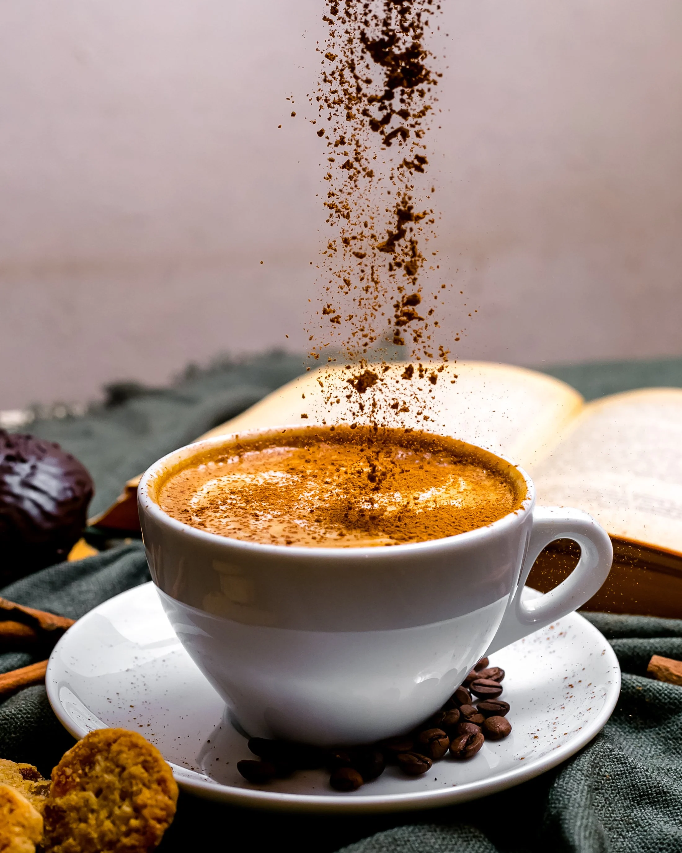 front-view-cup-cappuccino-with-cookies-book-table.jpg