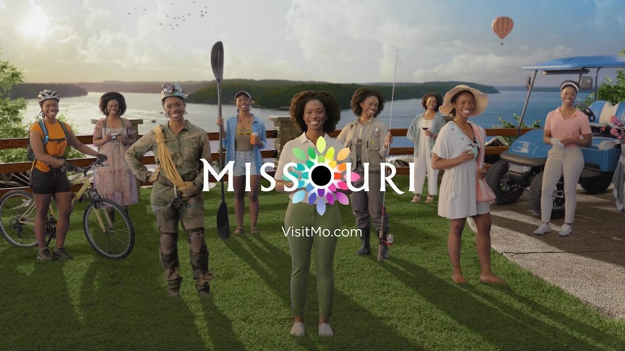 Group of smiling women with recreational activities by the water, with a hot air balloon in the sky, and the Missouri tourism logo overlayed.