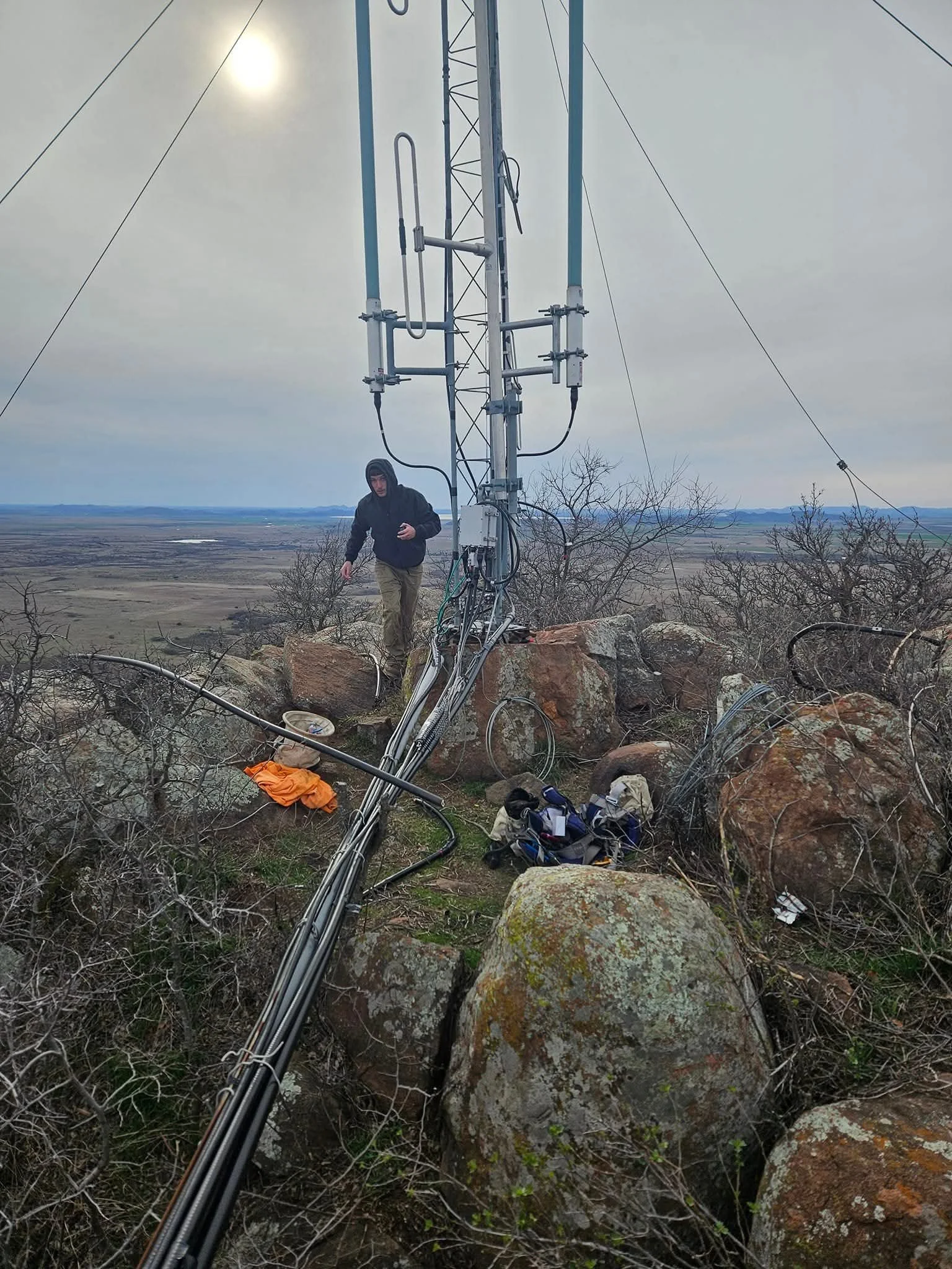 Communications tower and antenna installation project at Wichita Mountains Wildlife Refuge near Lawton, Oklahoma. Tower foundation and structural support installed on native rock formations, literally tying rock to rock. Demanding communications infr