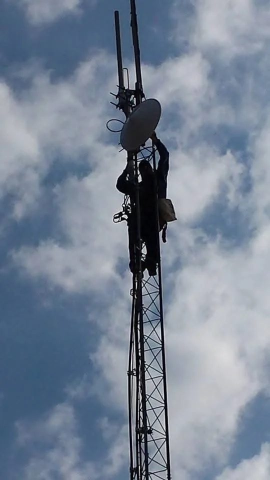 Precision microwave dish alignment on communications tower infrastructure. Green Country Tower Service provides microwave system installation, antenna alignment, equipment deployment, and communications infrastructure services nationwide.