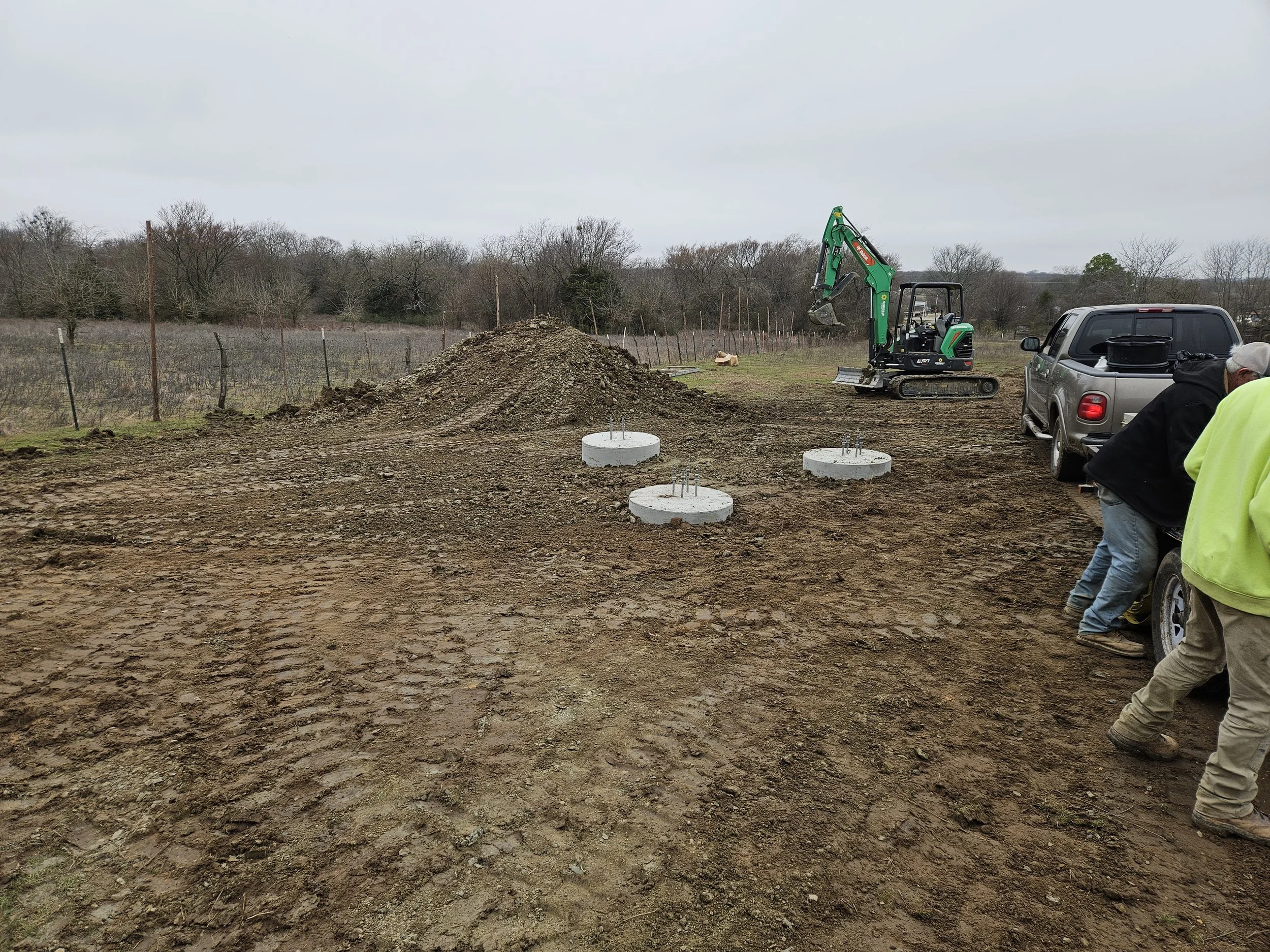 Civil site preparation and completed concrete foundation piers for a communications tower project. Site development, foundation construction, and infrastructure support services by Green Country Tower Service.