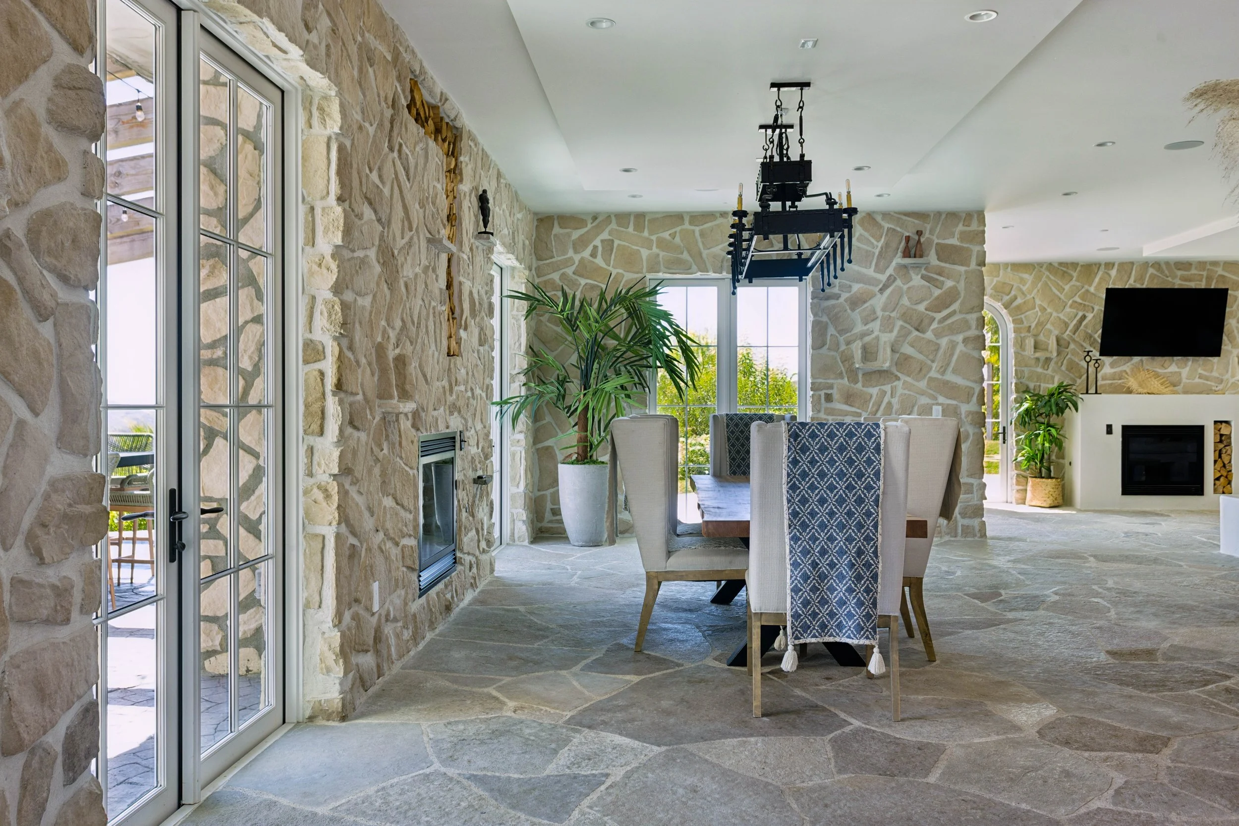 malibu-mediterranean-villa-great-room-open-steel-doors.jpg