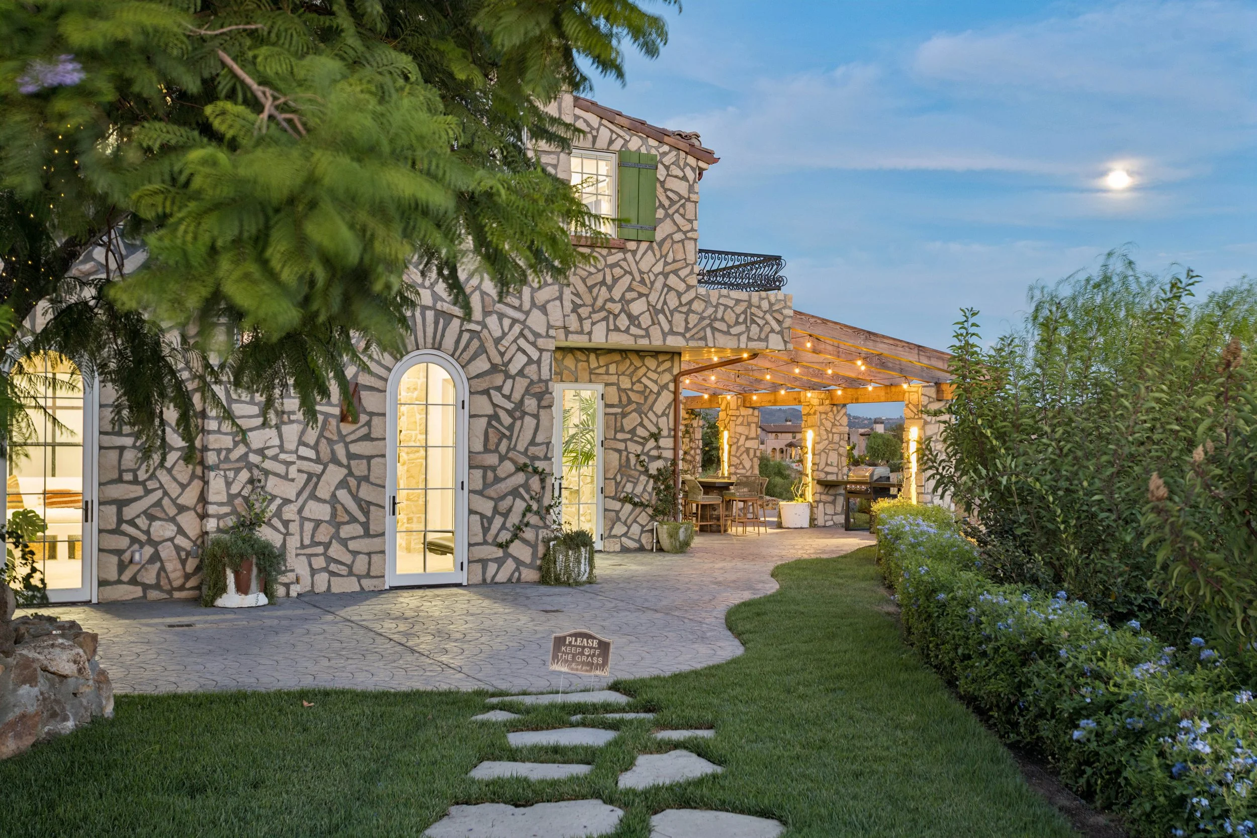 malibu-mediterranean-villa-courtyard-twilight.jpg