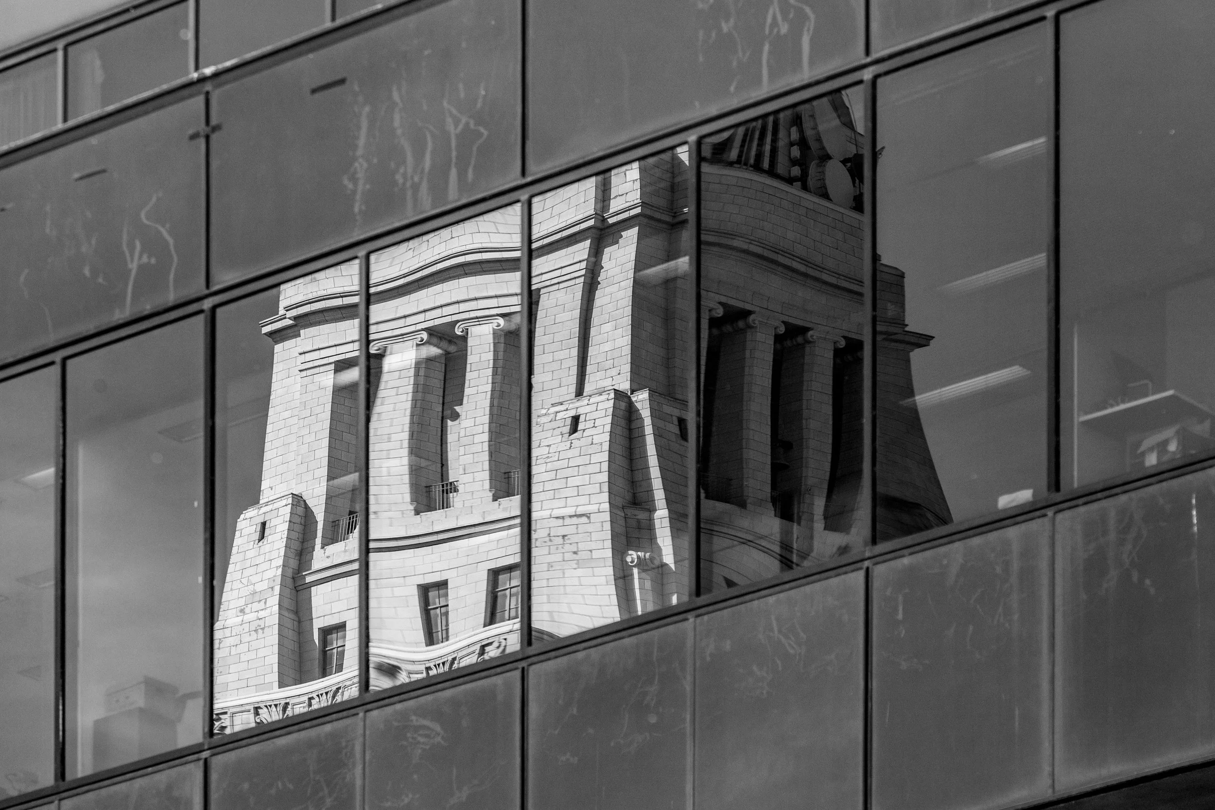 Historic architecture reflected and distorted in modern glass — Downtown Los Angeles