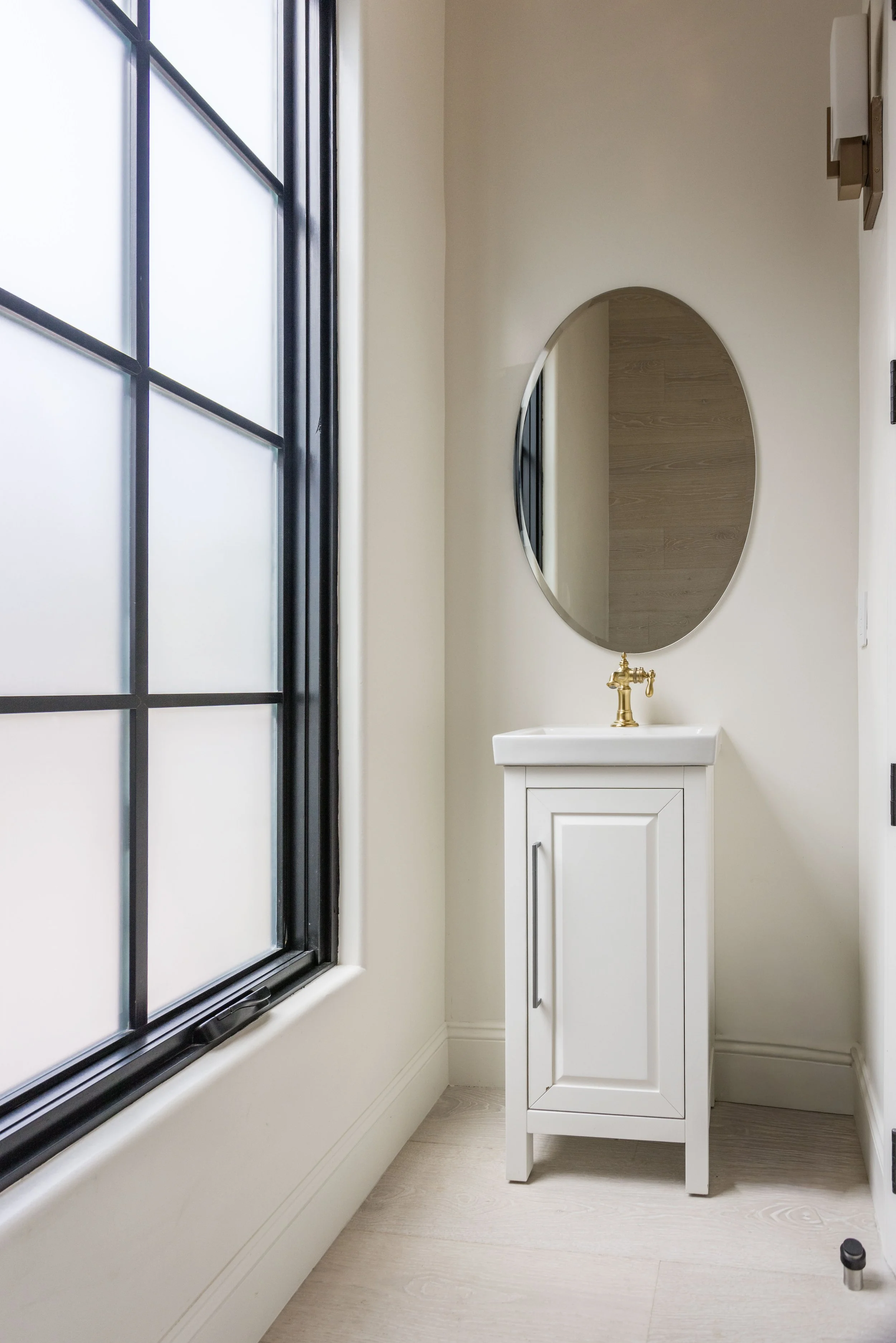 malibu-mediterranean-estate-powder-room-brass-faucet.jpg