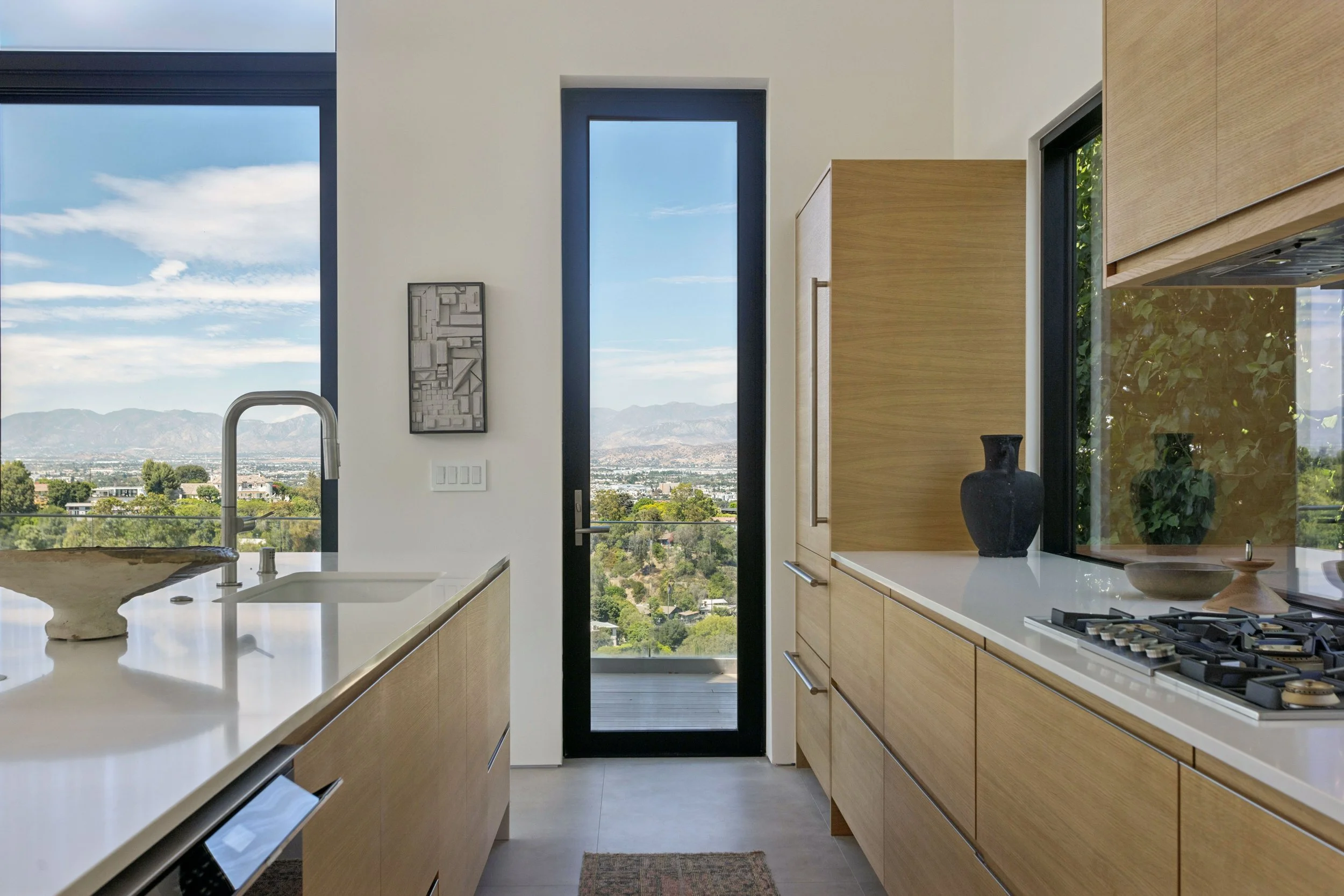 studio-city-modern-home-white-oak-kitchen-ribbon-window.jpg