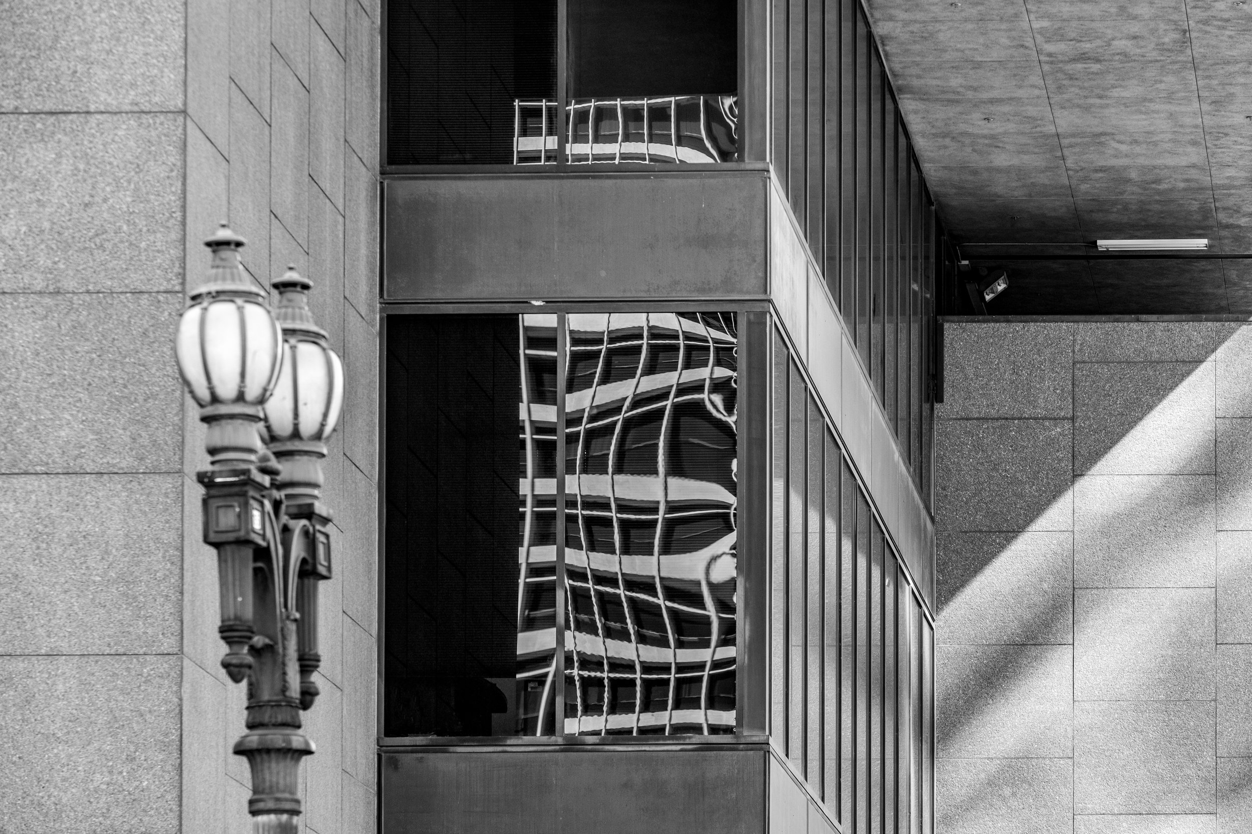 Historic architecture reflected and distorted in modern glass — Downtown Los Angeles