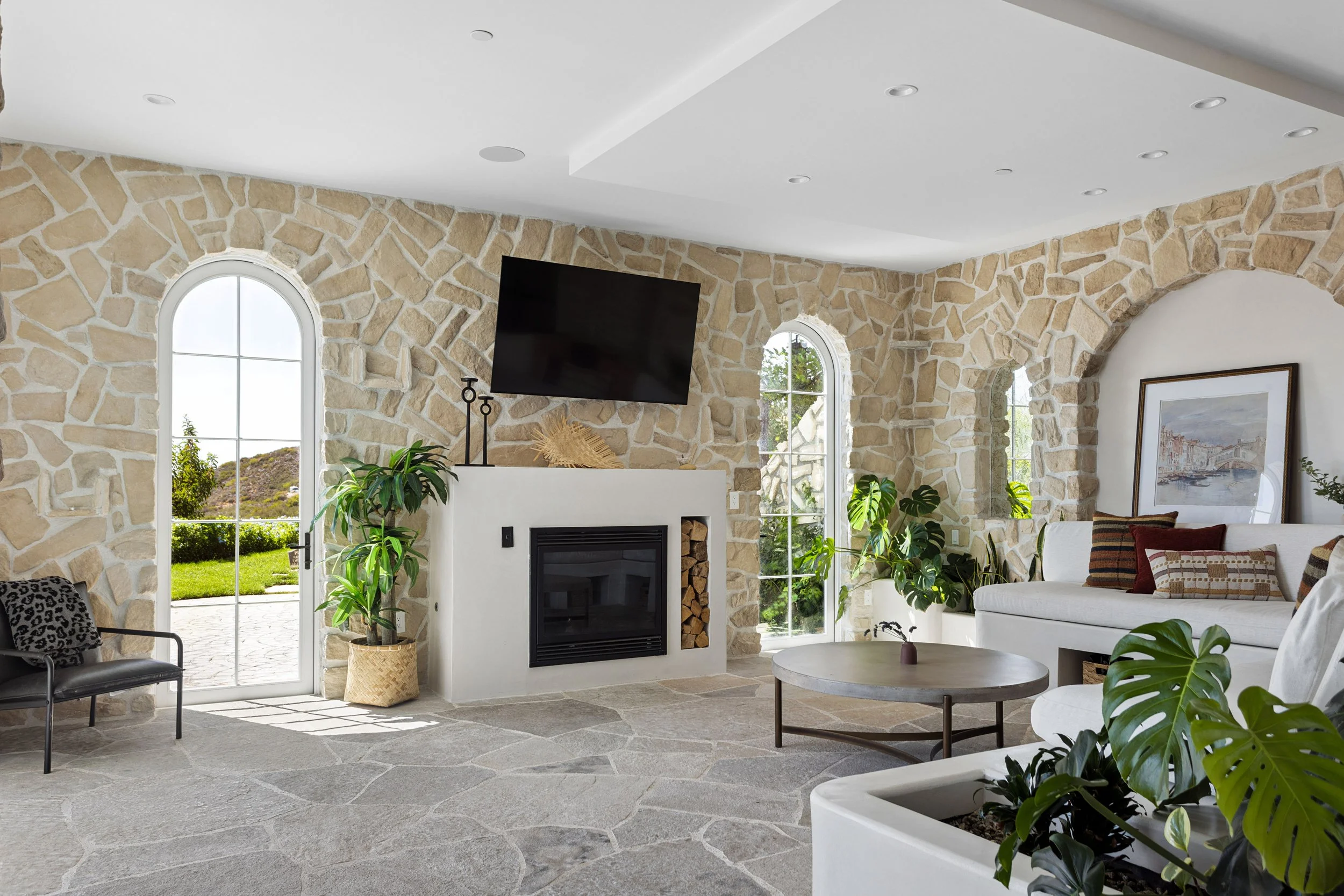 malibu-mediterranean-villa-stone-living-banquette.jpg