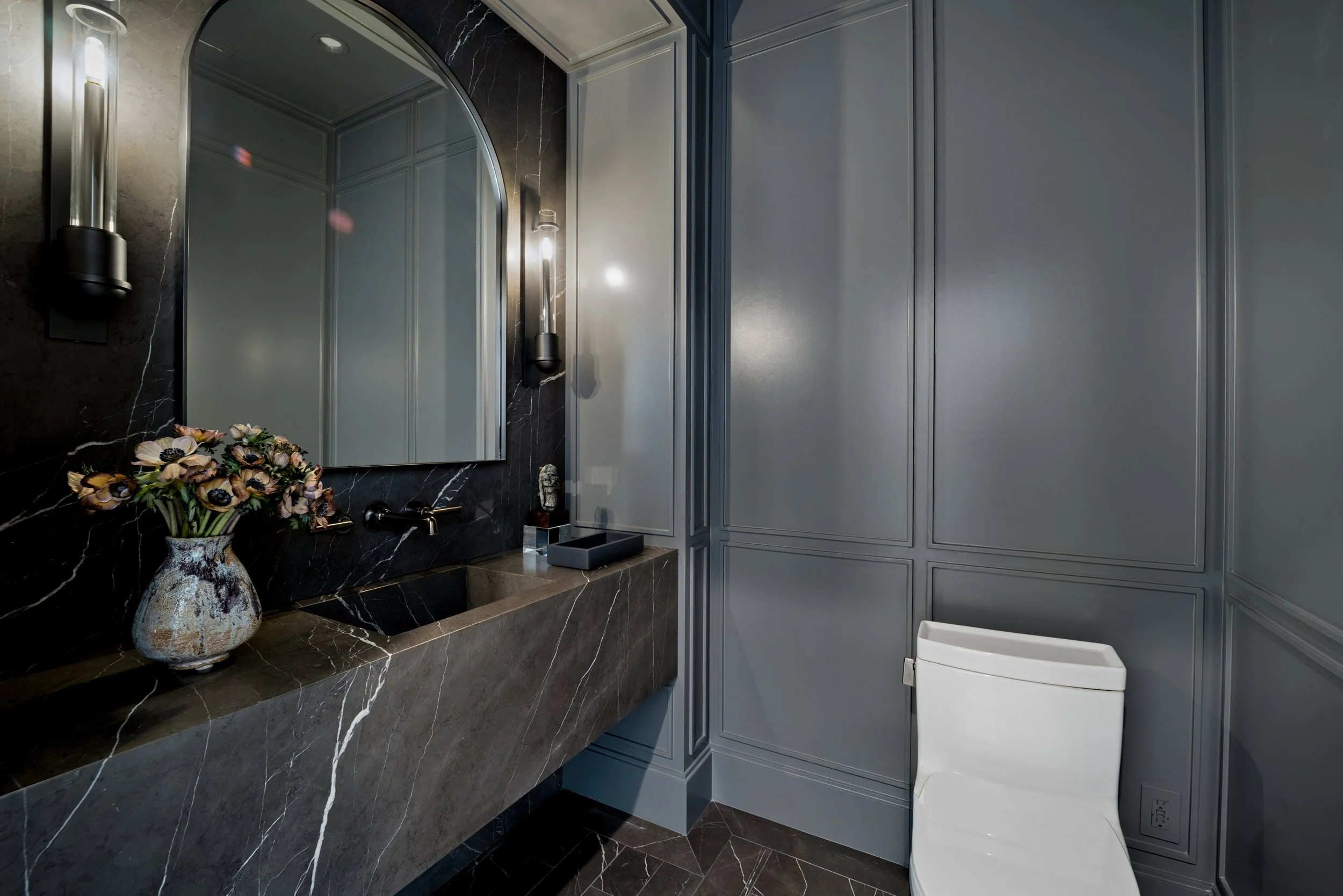 beverly-hills-luxury-powder-room-black-marble-arched-mirror.jpg