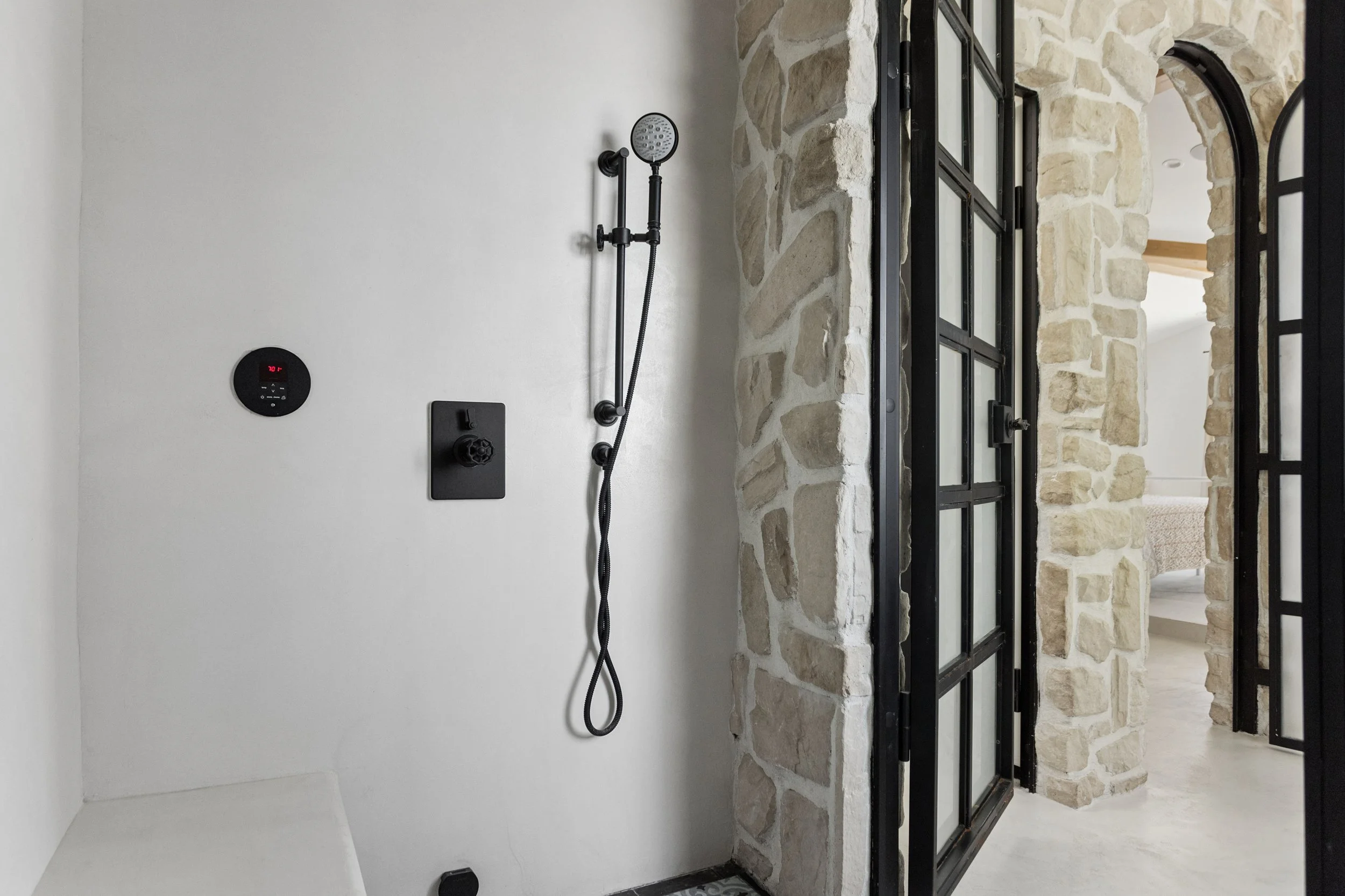 malibu-mediterranean-villa-stone-walk-in-shower.jpg