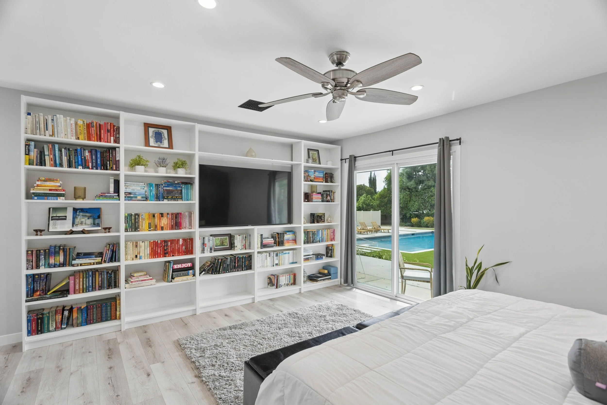 northridge-luxury-home-bedroom-built-in-bookshelves.jpg