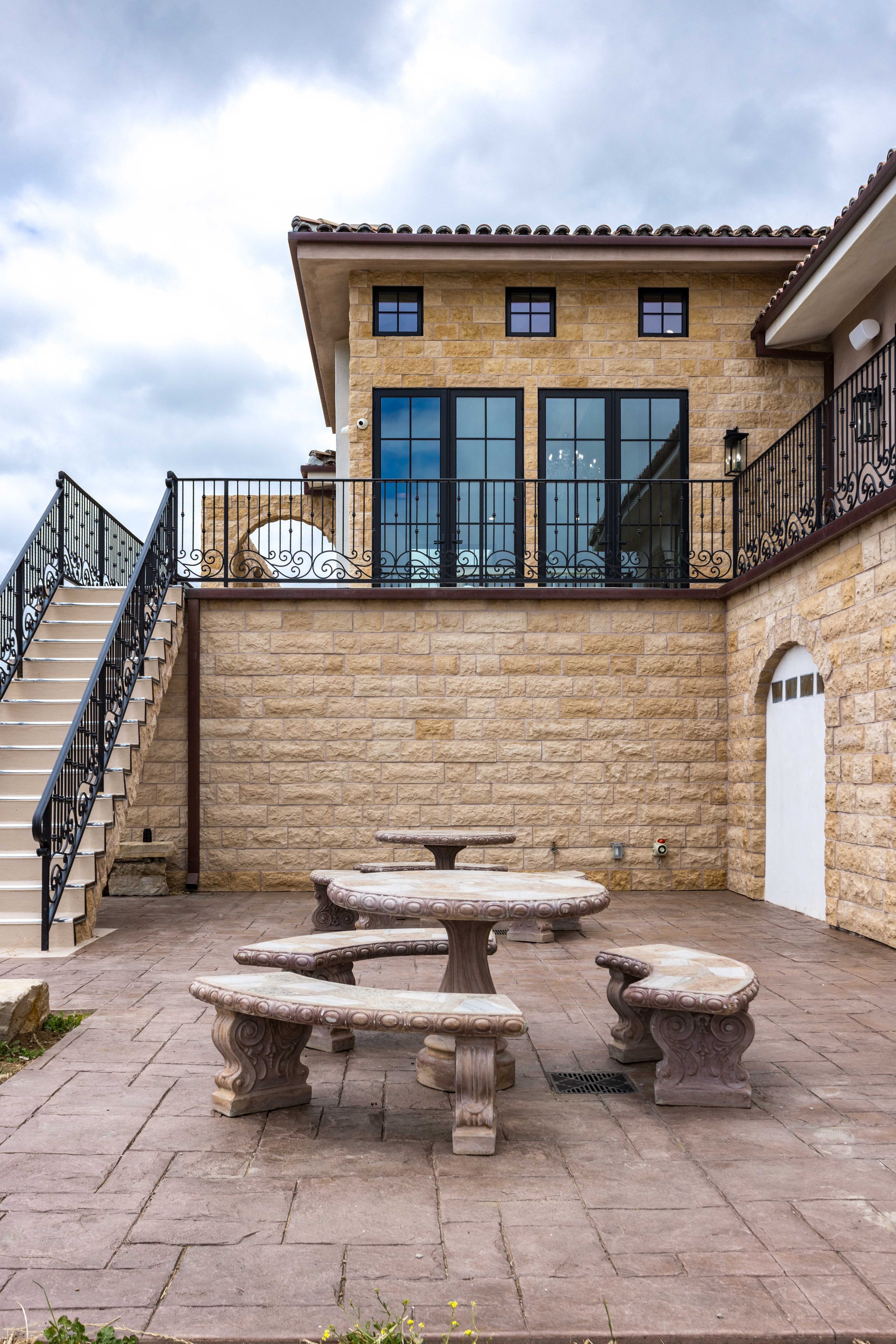 malibu-mediterranean-estate-back-patio-stone-balcony.jpg