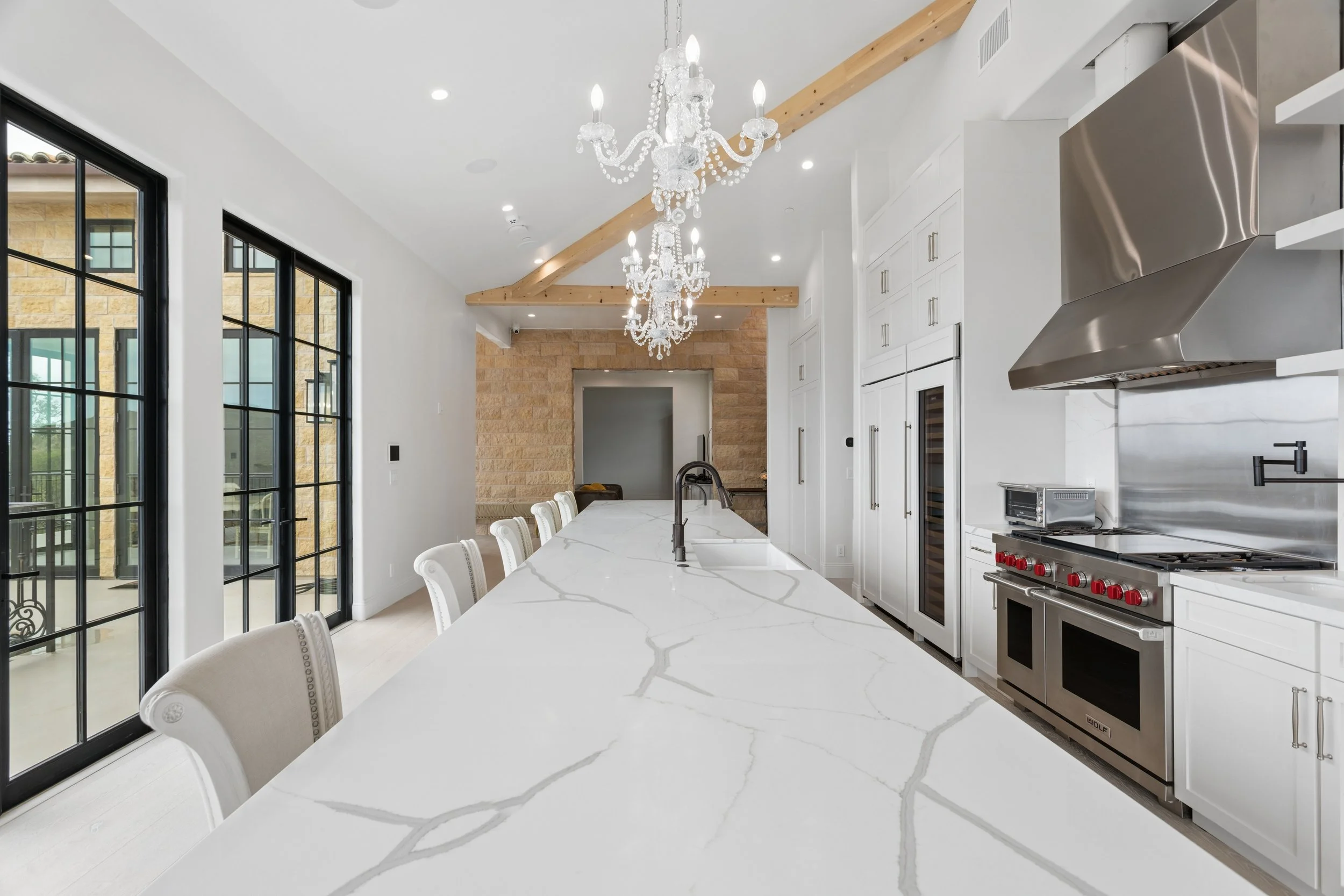 malibu-luxury-kitchen-marble-island-crystal-chandeliers.jpg