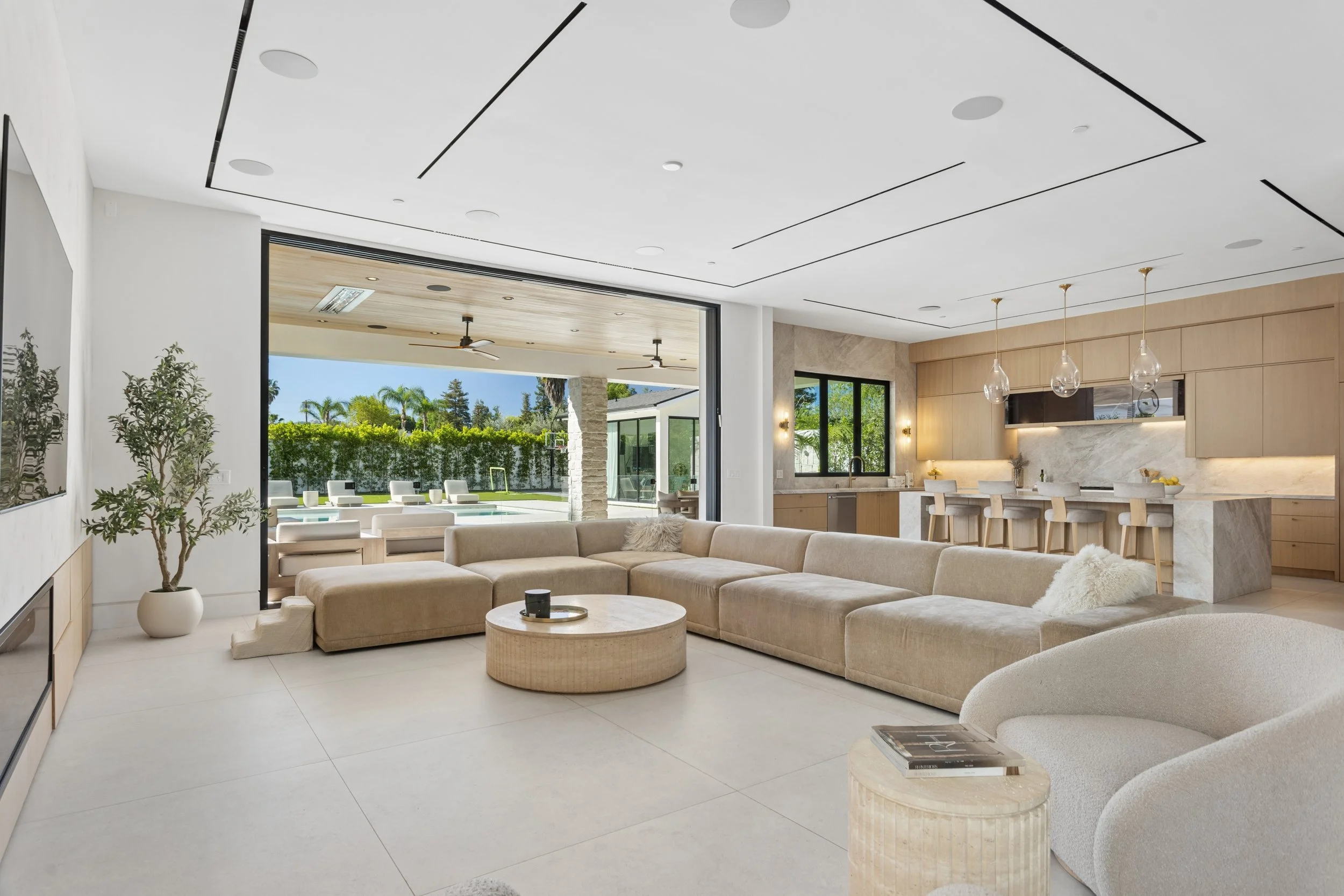woodland-hills-luxury-home-great-room-pool-view.jpg