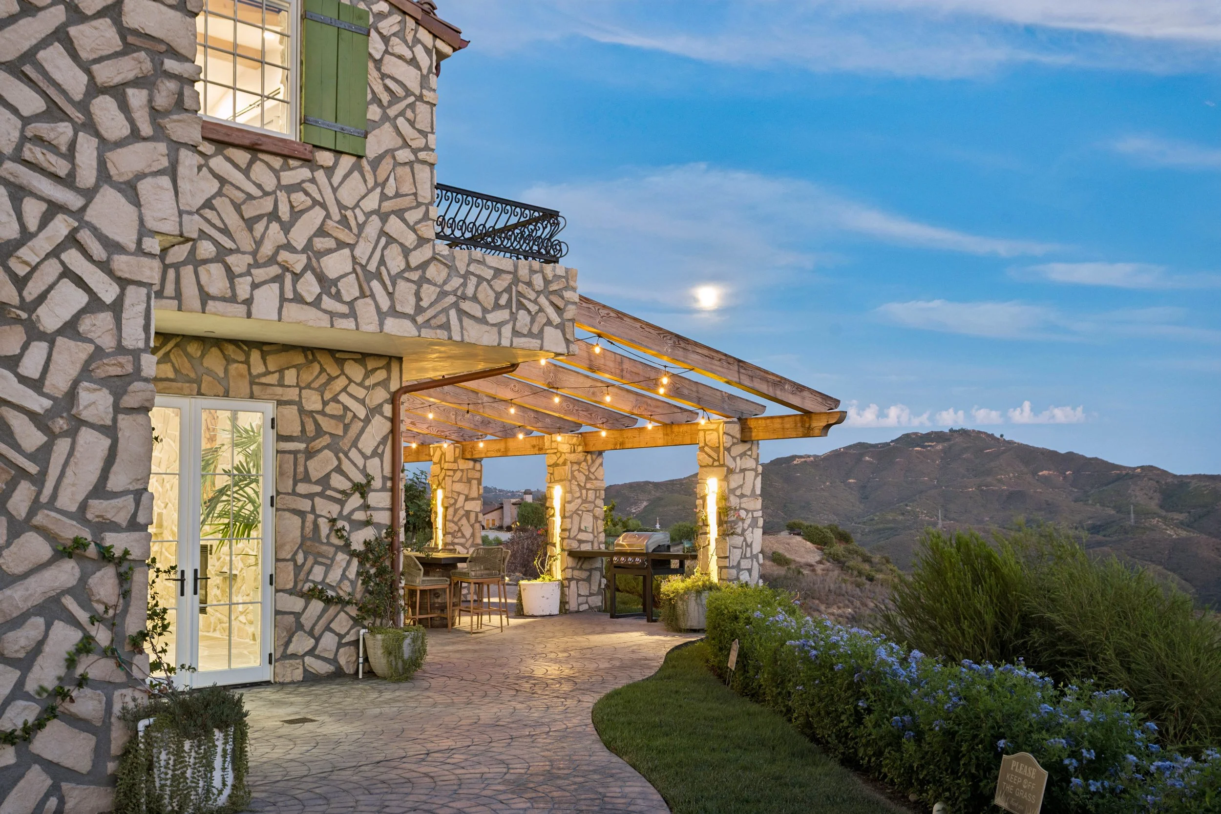 malibu-mediterranean-villa-stone-loggia-twilight.jpg