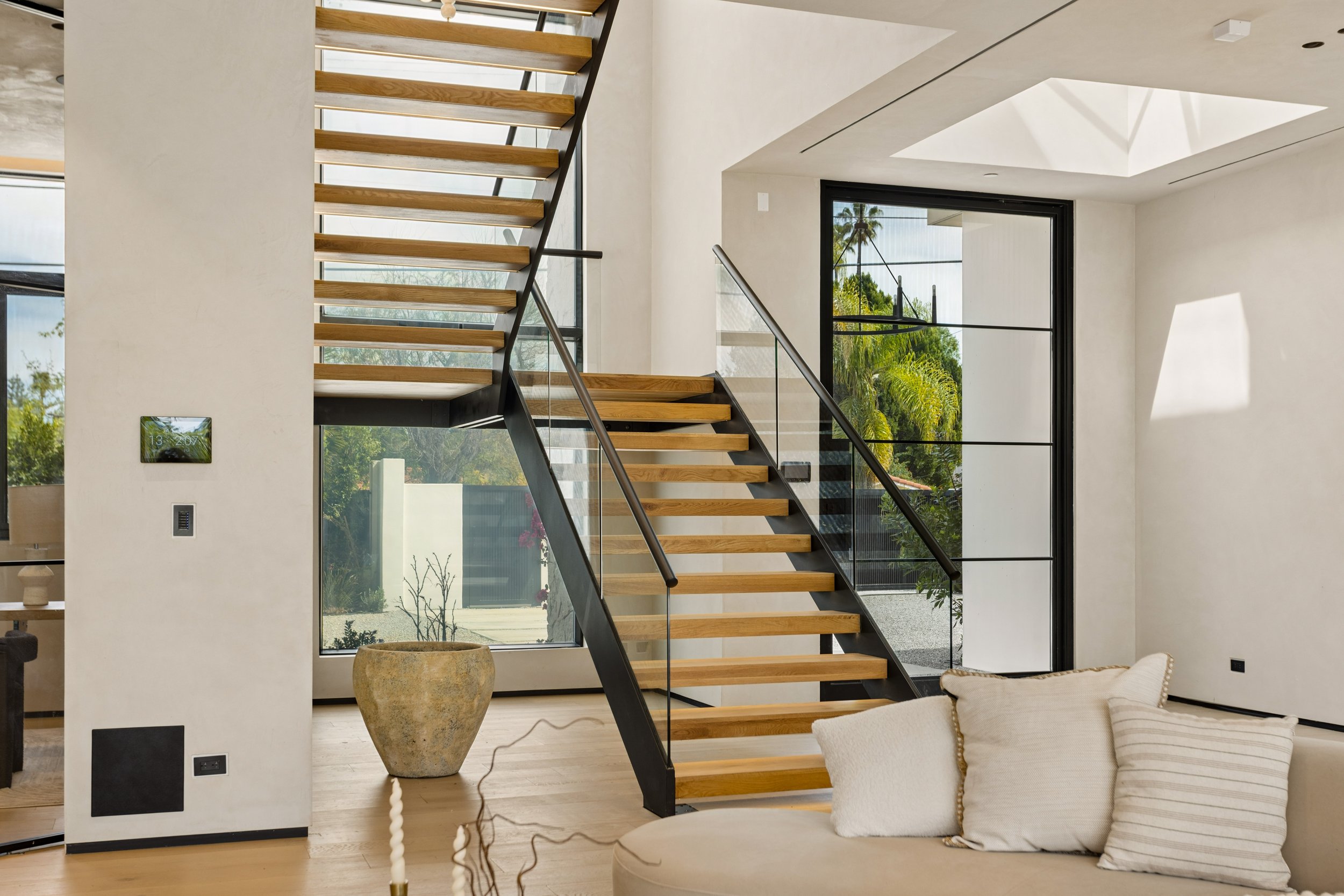 encino-modern-home-glass-rail-floating-wood-staircase.jpg