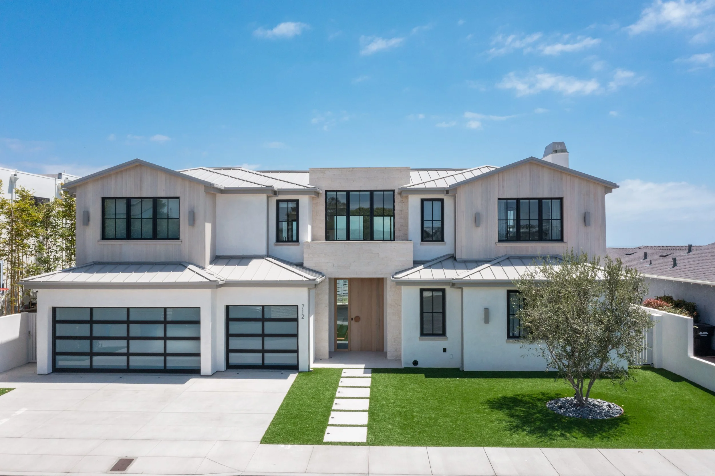 Architectural photography of a new-construction modern farmhouse on Marlita Place in Hermosa Beach, with ocean views. Daylight, golden-hour, and twilight coverage by iPhotographyHomes