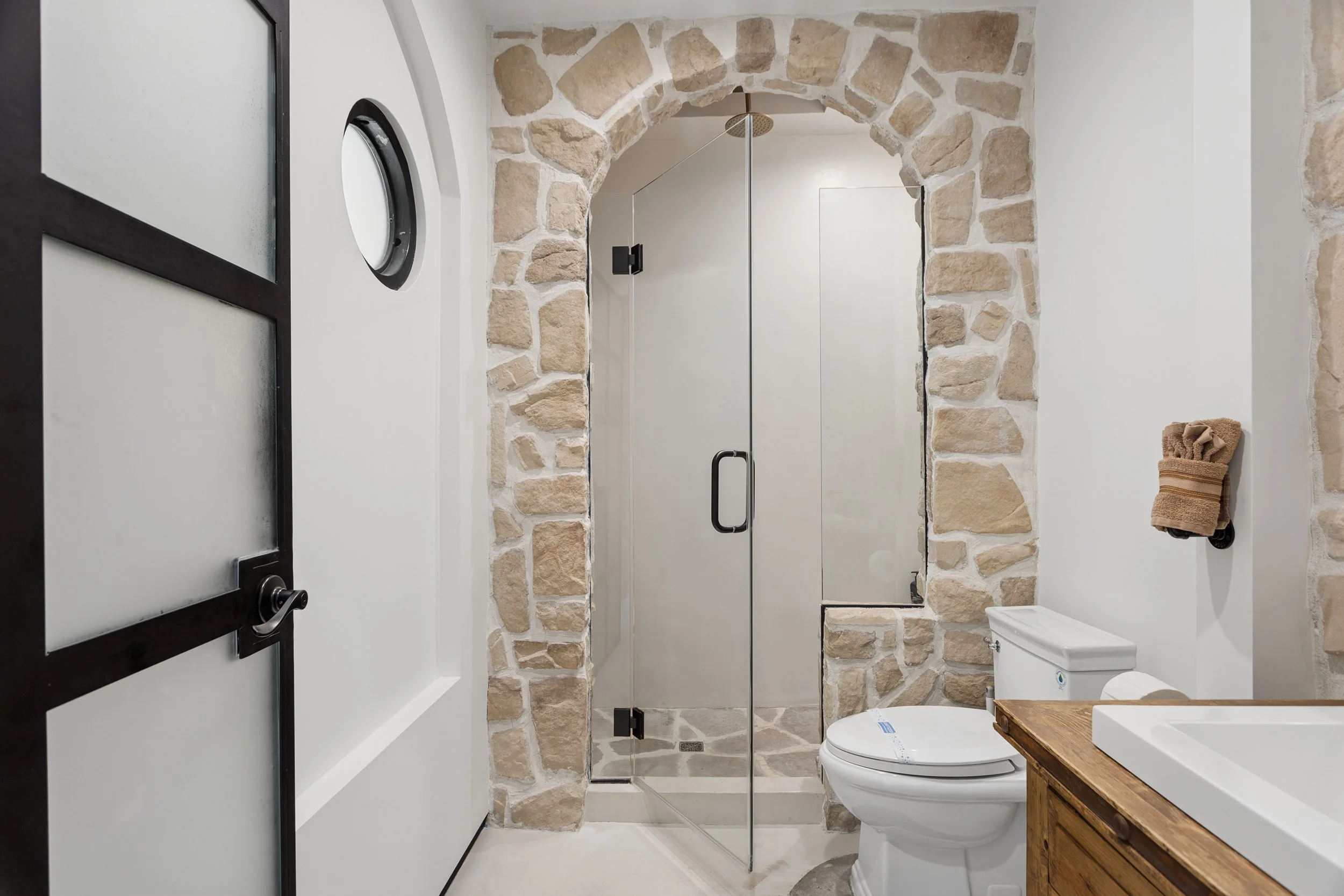 malibu-mediterranean-villa-bathroom-arched-steel-shower.jpg