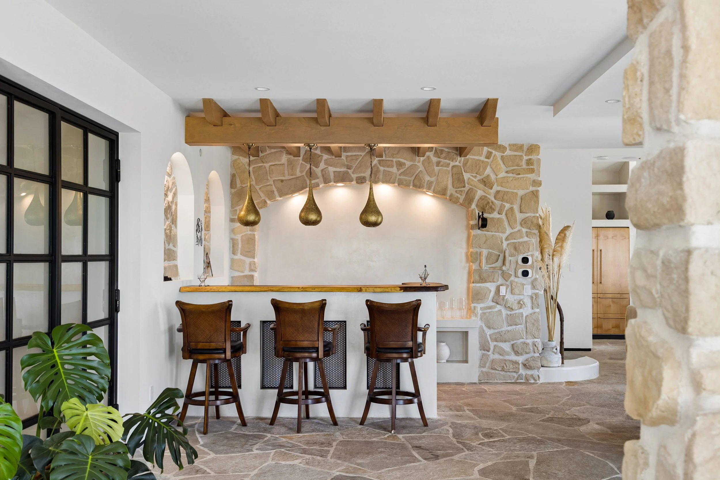 malibu-mediterranean-villa-stone-kitchen-bar.jpg