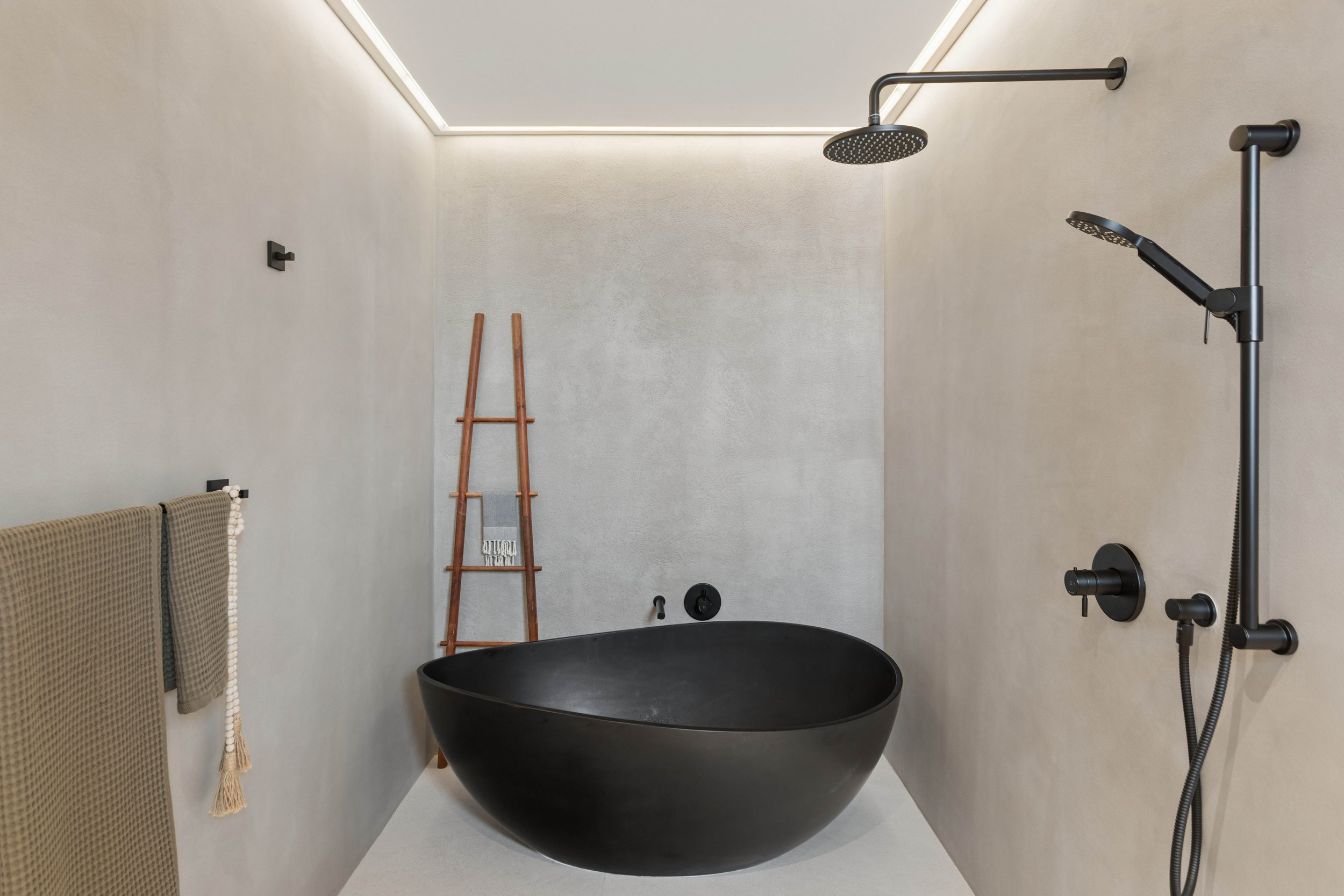 hermosa-beach-modern-farmhouse-wellness-bath-stone-tub.jpg