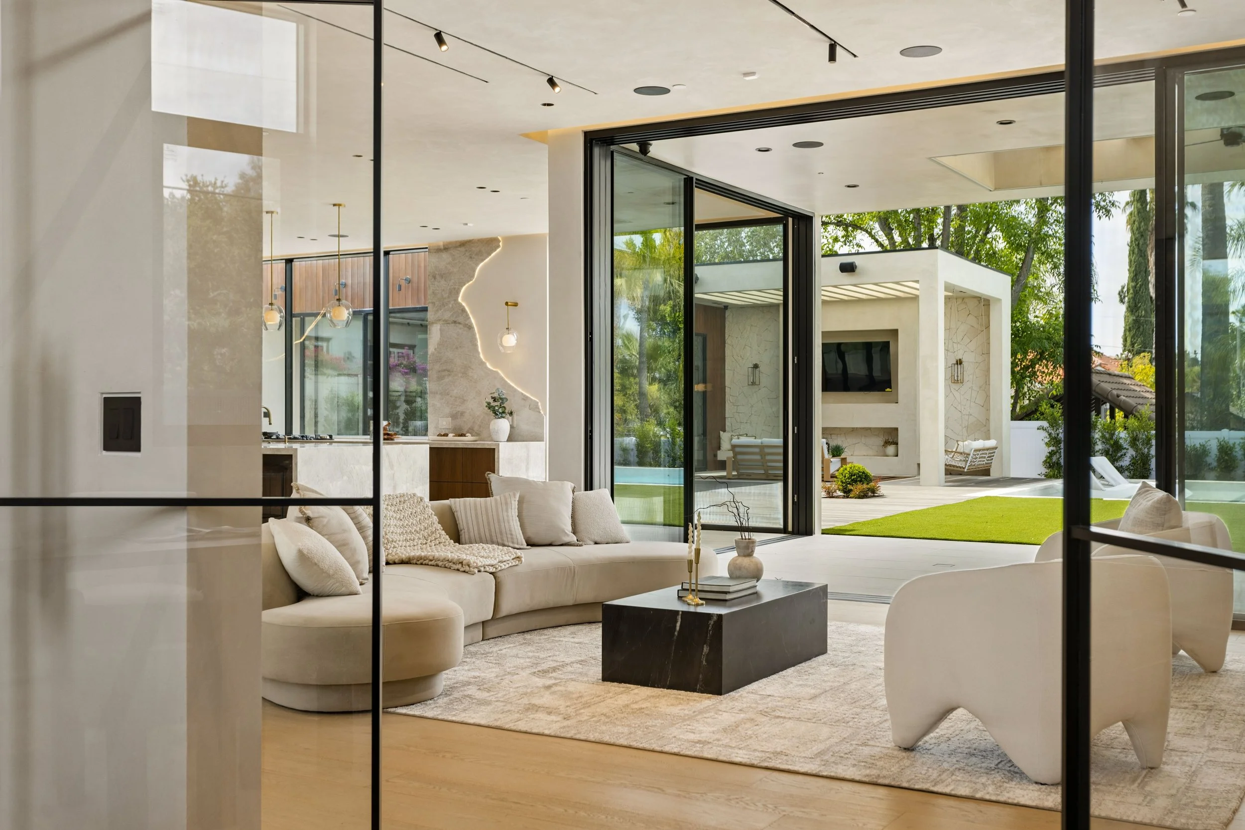 encino-modern-home-living-room-steel-pivot-doors.jpg