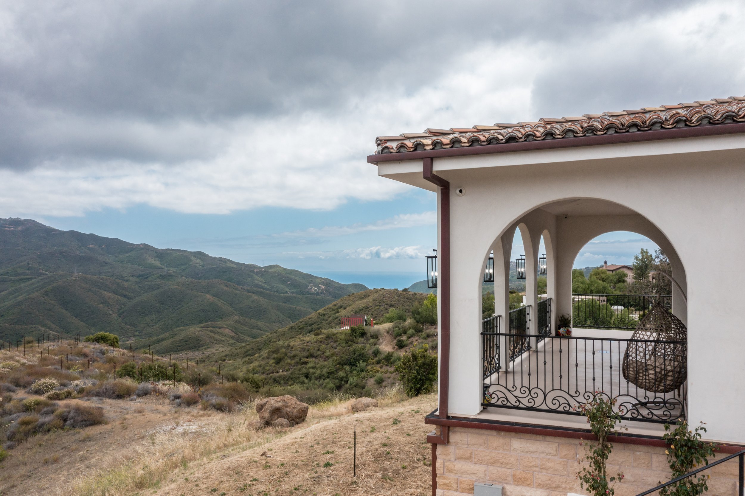 malibu-luxury-home-arched-balcony-santa-monica-mountains.jpg