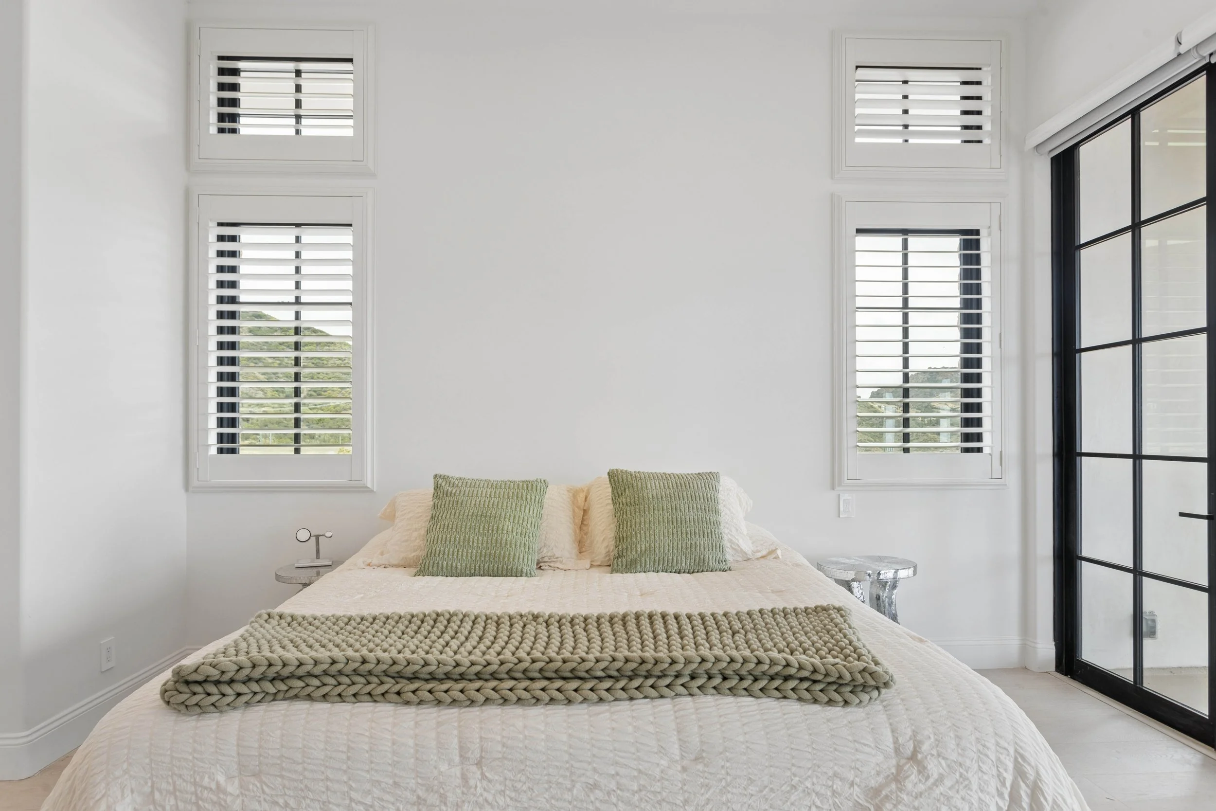 malibu-luxury-home-bedroom-plantation-shutters.jpg