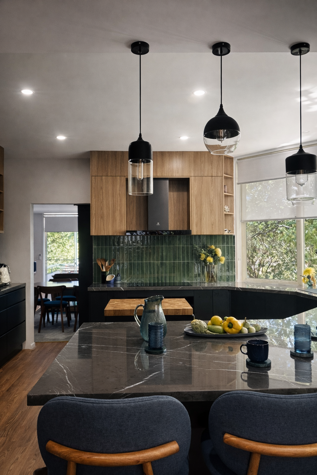 Wooden, black and green kitchen with black pendant lights