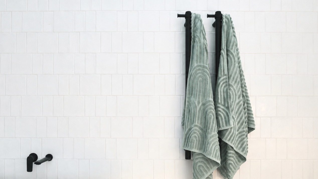 Renovated Bathroom with white tiled wall and black fixtures in a bathroom.
