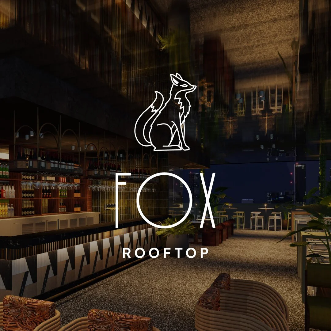 Nighttime rooftop bar with seating area, bar counter with bottles, plants, and city skyline view, logo of a fox and the text 'FOX ROOFTOP'. 