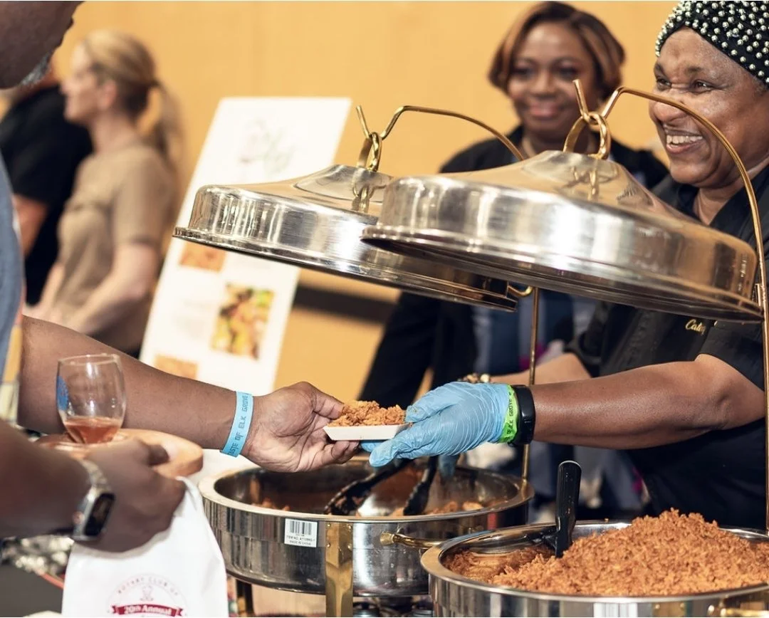 Photo of Lilian serving Jollof rice & chicken