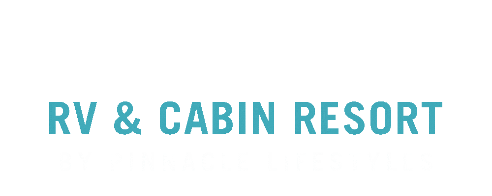 Logo for RV & Cabin Resort by Pinnacle Lifestyles with trees and a clear sky background.